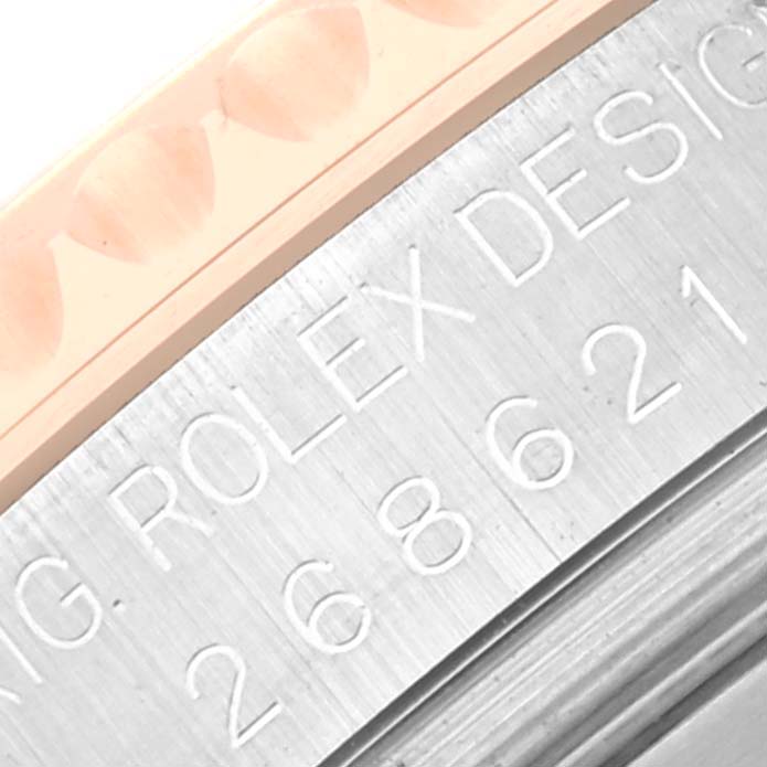 Close-up view of the engraving on the bezel of a Rolex Yacht-Master 268621 Men's Steel and Gold (two tone) Brown Dial 268621 Men's Steel and Gold (two tone) Brown Dial watch.