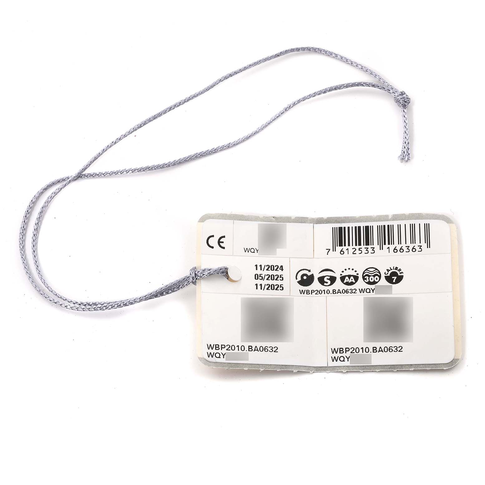 The image shows a Tag Heuer Aquaracer WBP2010.BA0632 Men's Stainless Steel Blue Dial WBP2010.BA0632 Men's Stainless Steel Blue Dial model WBP2010.BA0632 hanging tag with certifications, barcodes, and manufacturing dates.