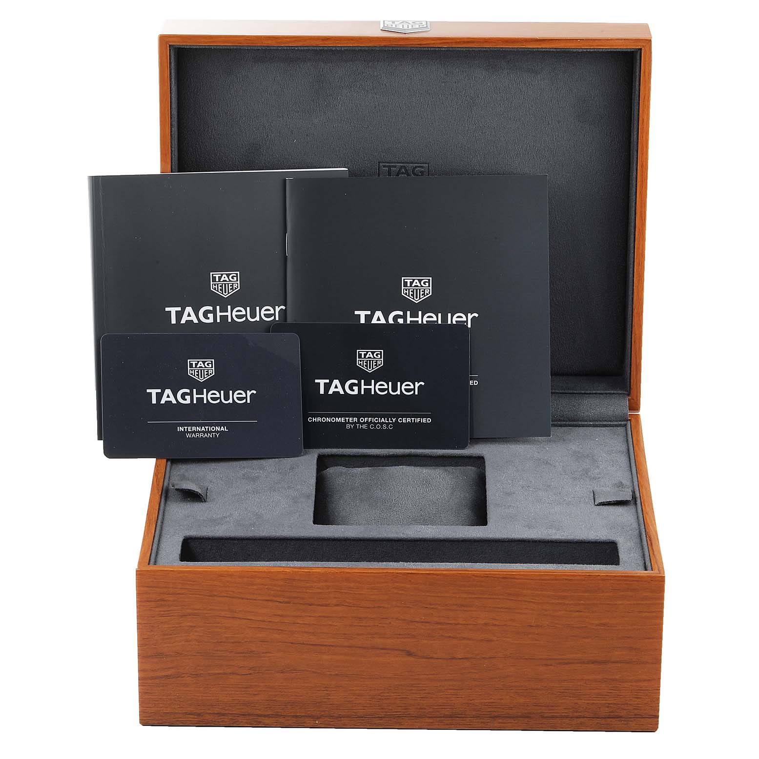 The image shows a Tag Heuer Autavia WBE5114.EB0173 Men's Stainless Steel Brown Dial WBE5114.EB0173 Men's Stainless Steel Brown Dial watch box including booklets and warranty cards, viewed from the front at eye level.