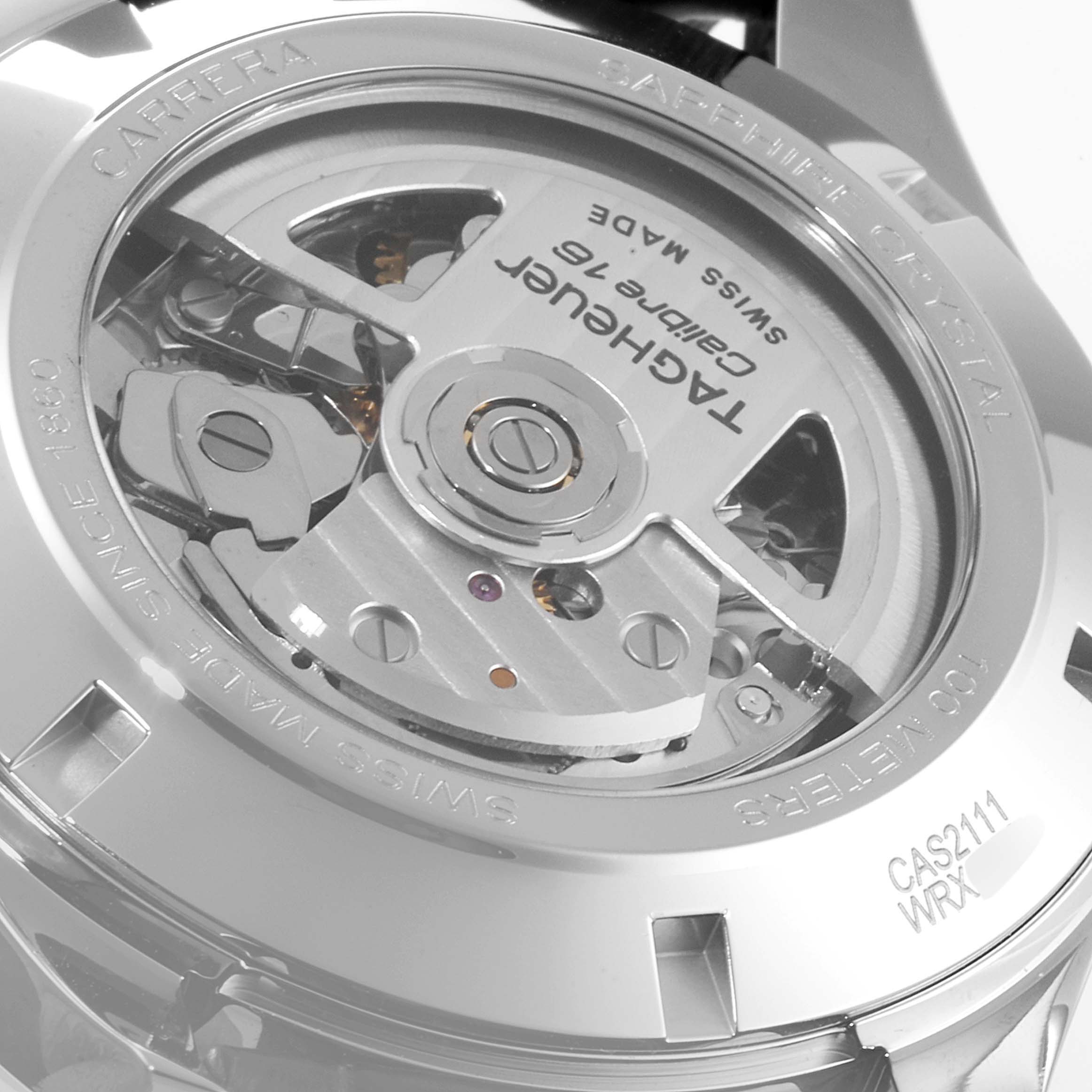 The image shows the back view of the Tag Heuer Carrera CAS2111 Men's Stainless Steel Silver Dial CAS2111 Men's Stainless Steel Silver Dial watch, highlighting the movement and engravings on the caseback.