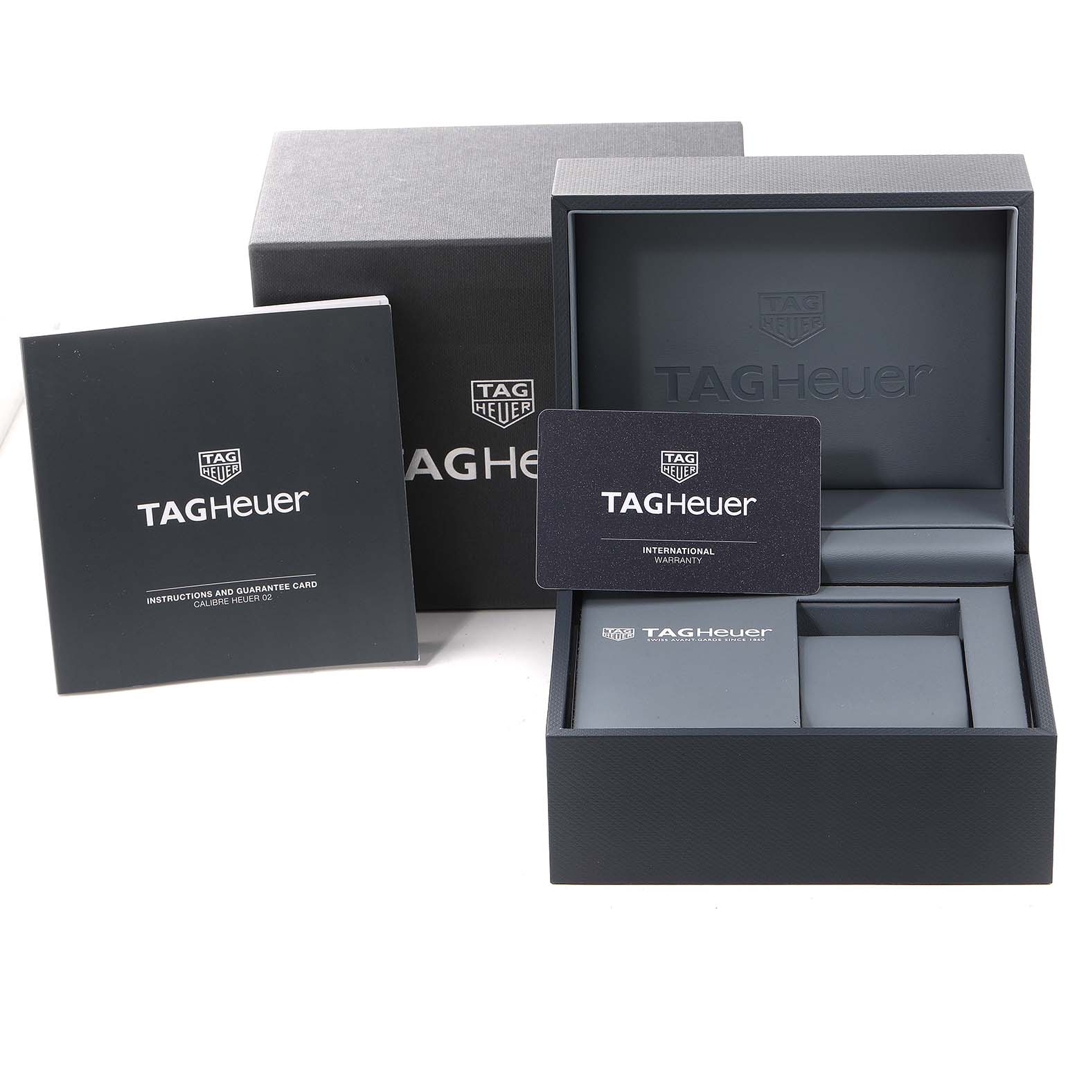 The image shows the open box, warranty card, and instruction manual for the Tag Heuer Carrera CBG2A10.FT6168 Men
s Stainless Steel Black Dial CBG2A10.FT6168 Men
s Stainless Steel Black Dial model watch.