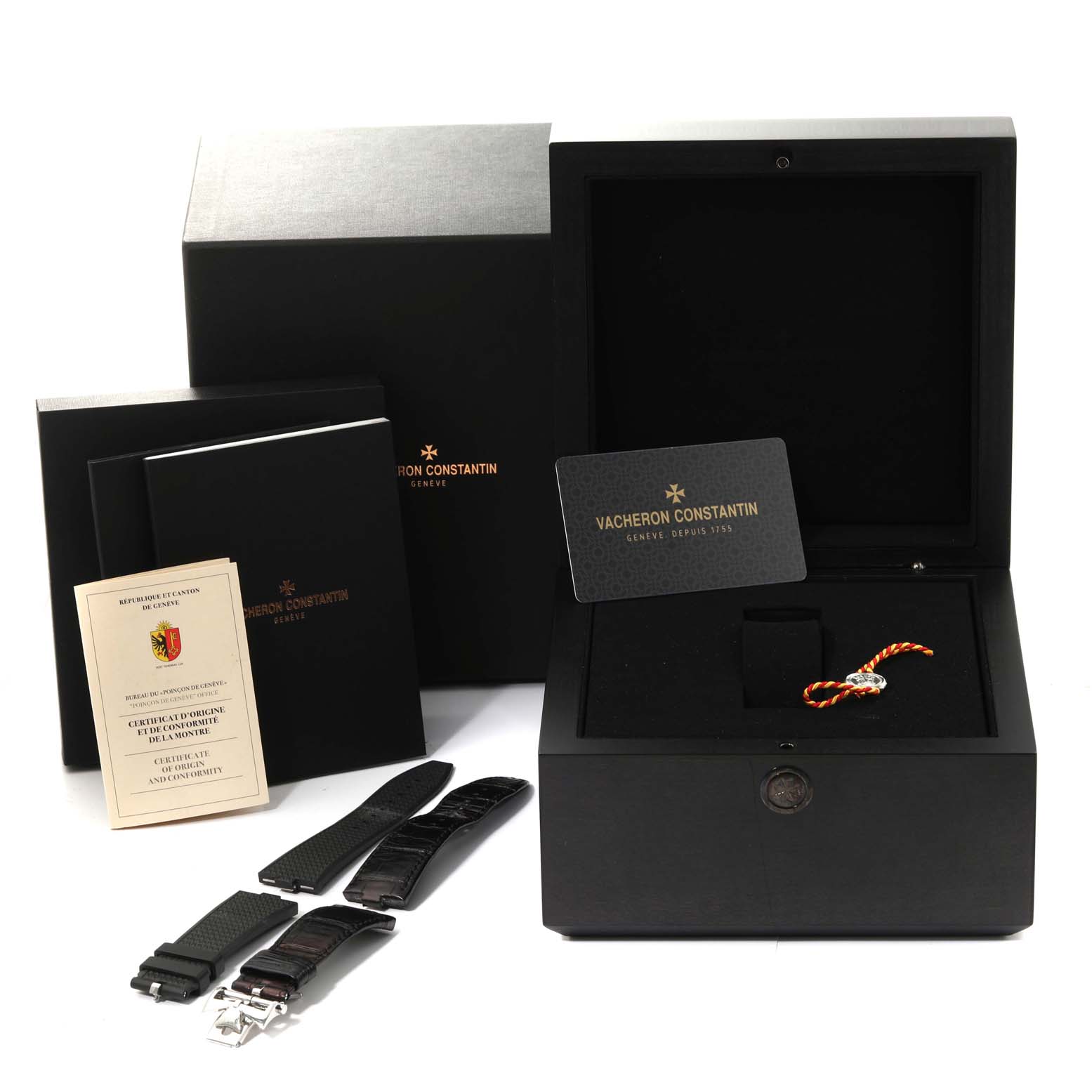 The image shows a Vacheron Constantin Overseas 7900V/110A Men's Stainless Steel Silver Dial 7900V/110A Men's Stainless Steel Silver Dial watch box set, including straps, a certificate, a booklet, and a card.