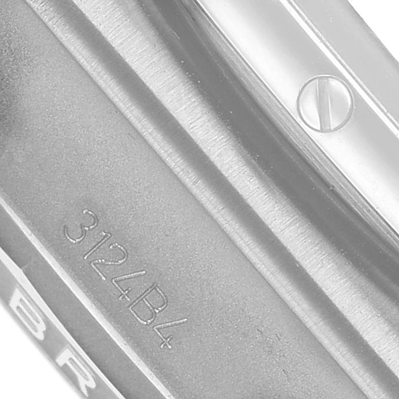 The image shows a close-up of the case back edge and part of the bezel screw on a Breitling Chronomat AB0134 Men's Stainless Steel Green Dial watch.