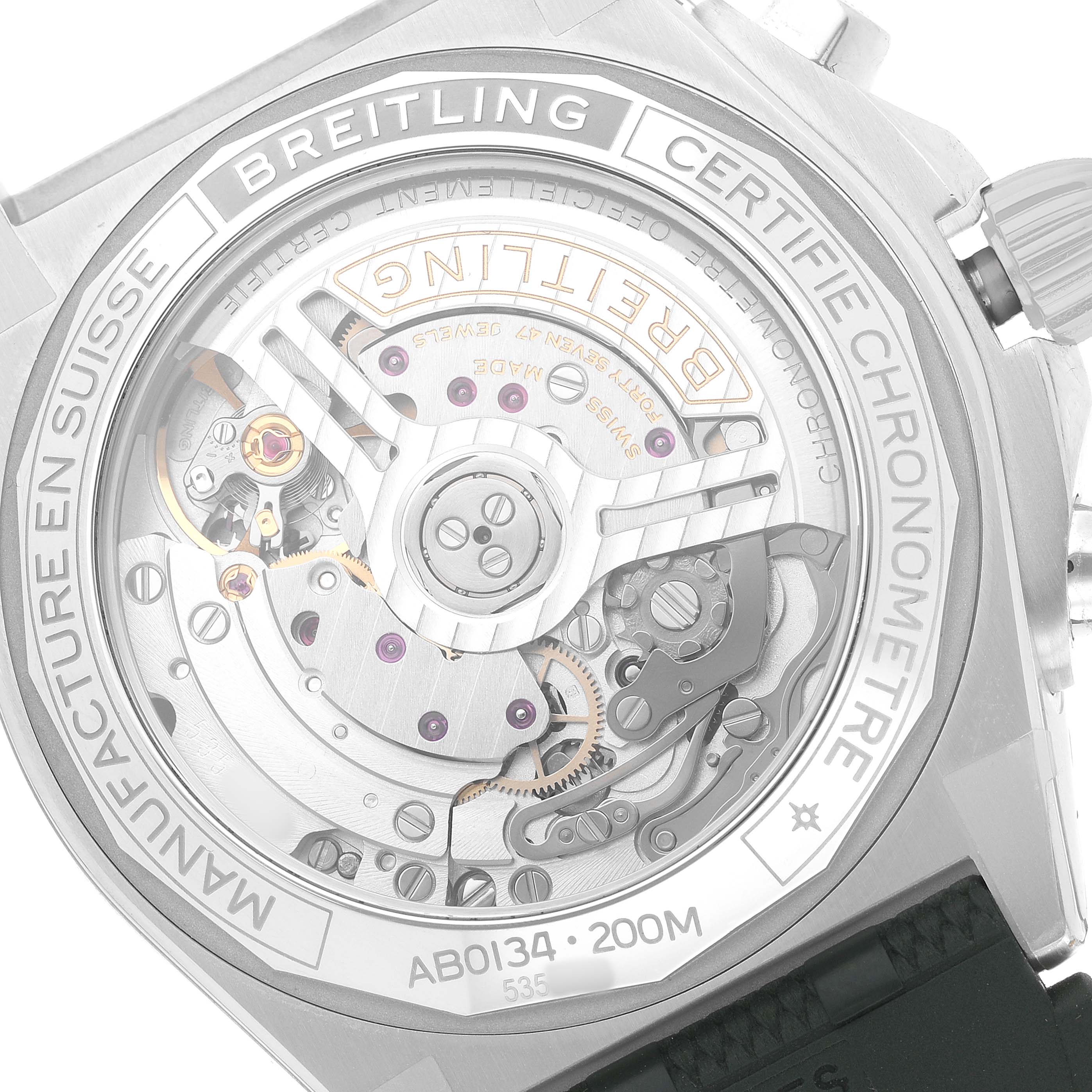 The image shows the back of a Breitling Chronomat AB0134 Men's Stainless Steel Green Dial watch, highlighting its mechanical movement and intricate components.