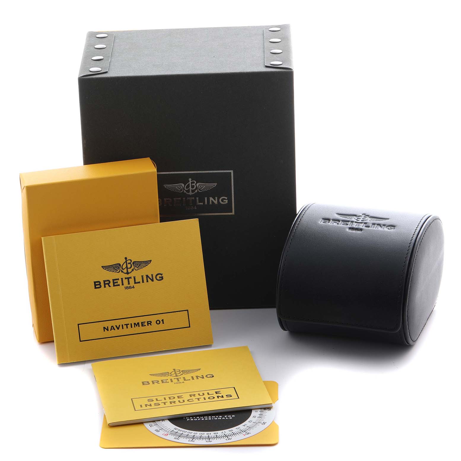 The image shows the Breitling Navitimer AB0123 Men's Stainless Steel Silver Dial AB0123 Men's Stainless Steel Silver Dial packaging, manuals, and a round leather case from a slightly elevated angle.