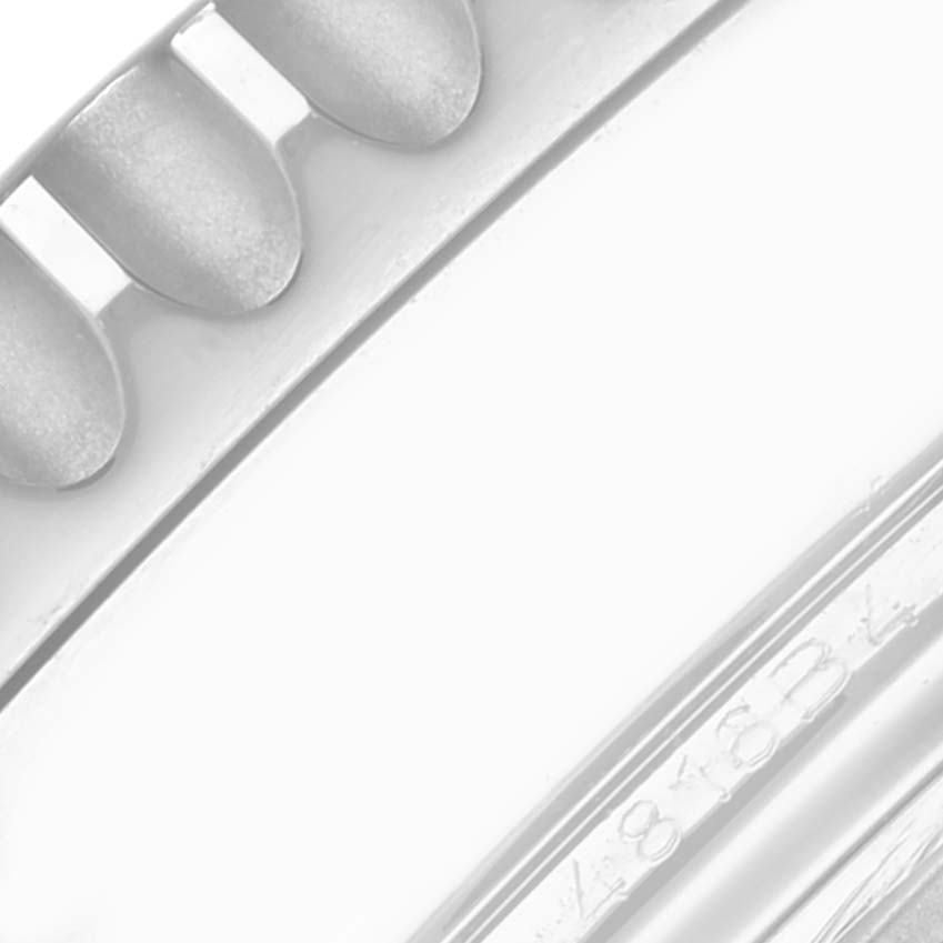 The image shows a close-up of the bezel edge on a Breitling Navitimer AB0441 Men's Stainless Steel Black Dial AB0441 Men's Stainless Steel Black Dial watch, highlighting its notched design and detail.