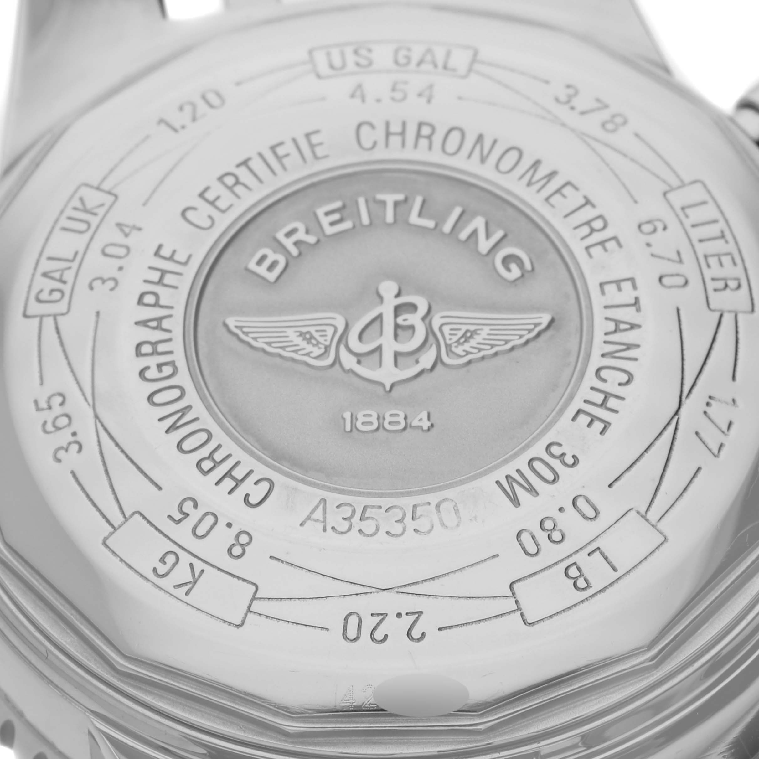 The image shows the case back of a Breitling Navitimer A35350 Men's Stainless Steel Blue Dial A35350 Men's Stainless Steel Blue Dial watch, displaying engravings and the brand logo.
