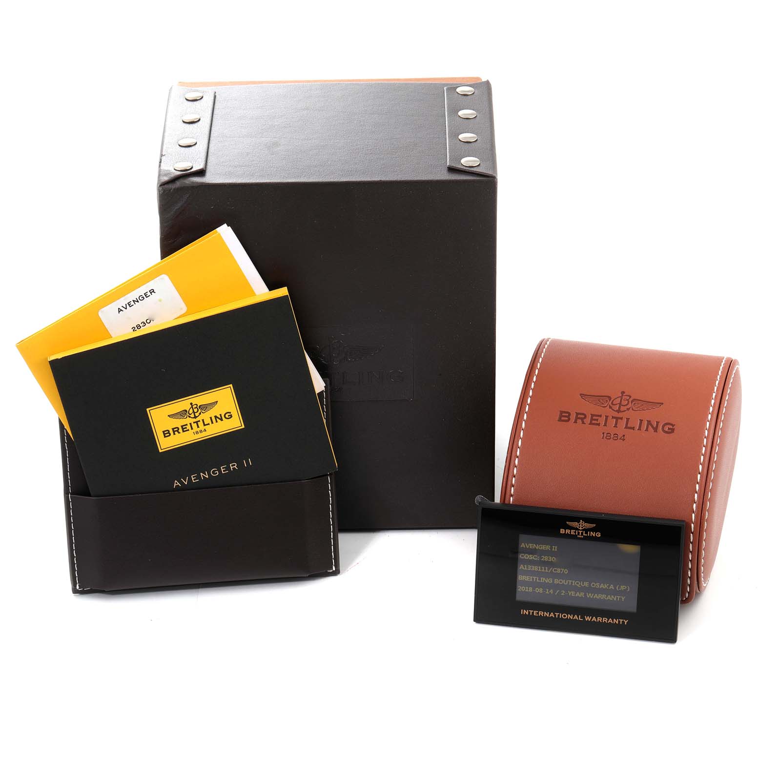 The image shows the Breitling Avenger A13381 Men's Stainless Steel Blue Dial A13381 Men's Stainless Steel Blue Dial watch's accessories, including manuals, a warranty card, a leather case, and a storage box.