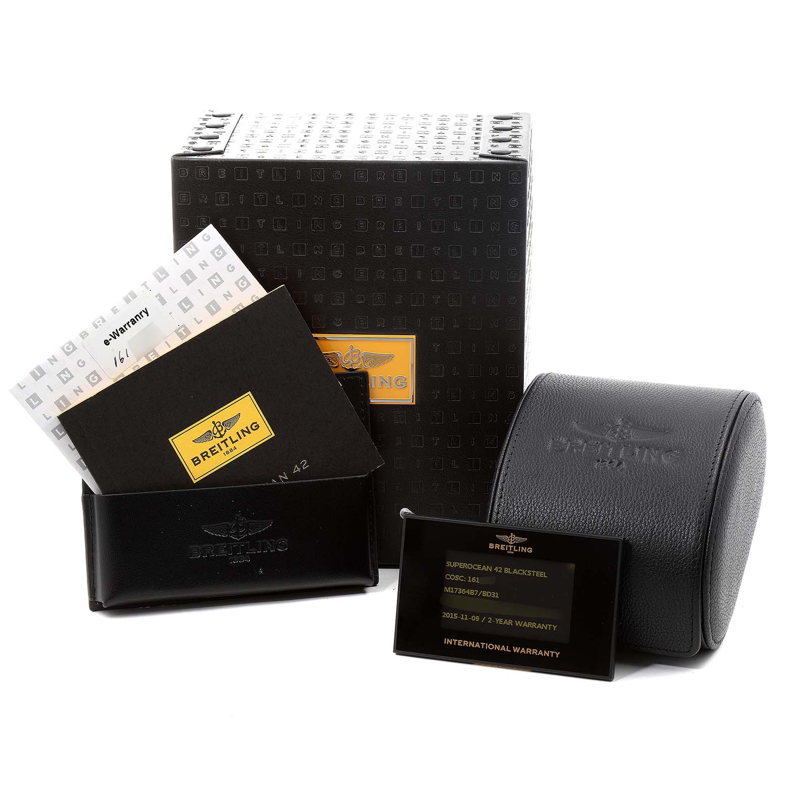 The image shows the packaging, warranty cards, and documents for a Breitling Superocean M17364 Men
s Stainless Steel Black Dial M17364 Men
s Stainless Steel Black Dial model watch.