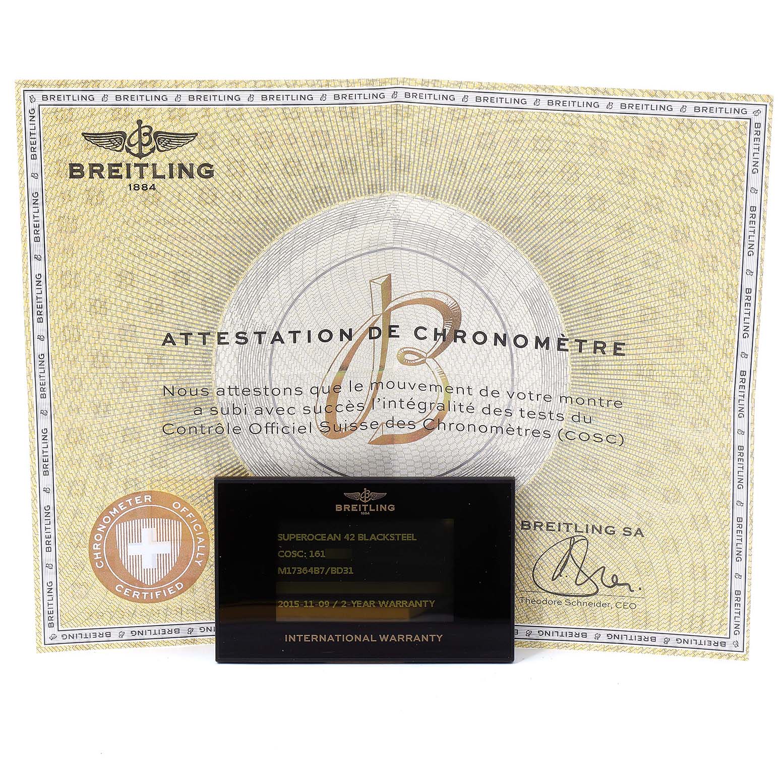 The image shows a warranty card and chronometer certification for a Breitling Superocean M17364 Men
s Stainless Steel Black Dial M17364 Men
s Stainless Steel Black Dial watch model.