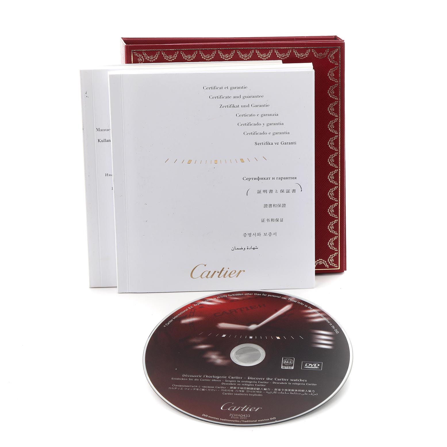 The image shows a Cartier Ballon Bleu WE902044 Women's Steel and Gold (two tone) Silver Dial WE902044 Women's Steel and Gold (two tone) Silver Dial's manuals and warranty booklet, along with a promotional DVD.