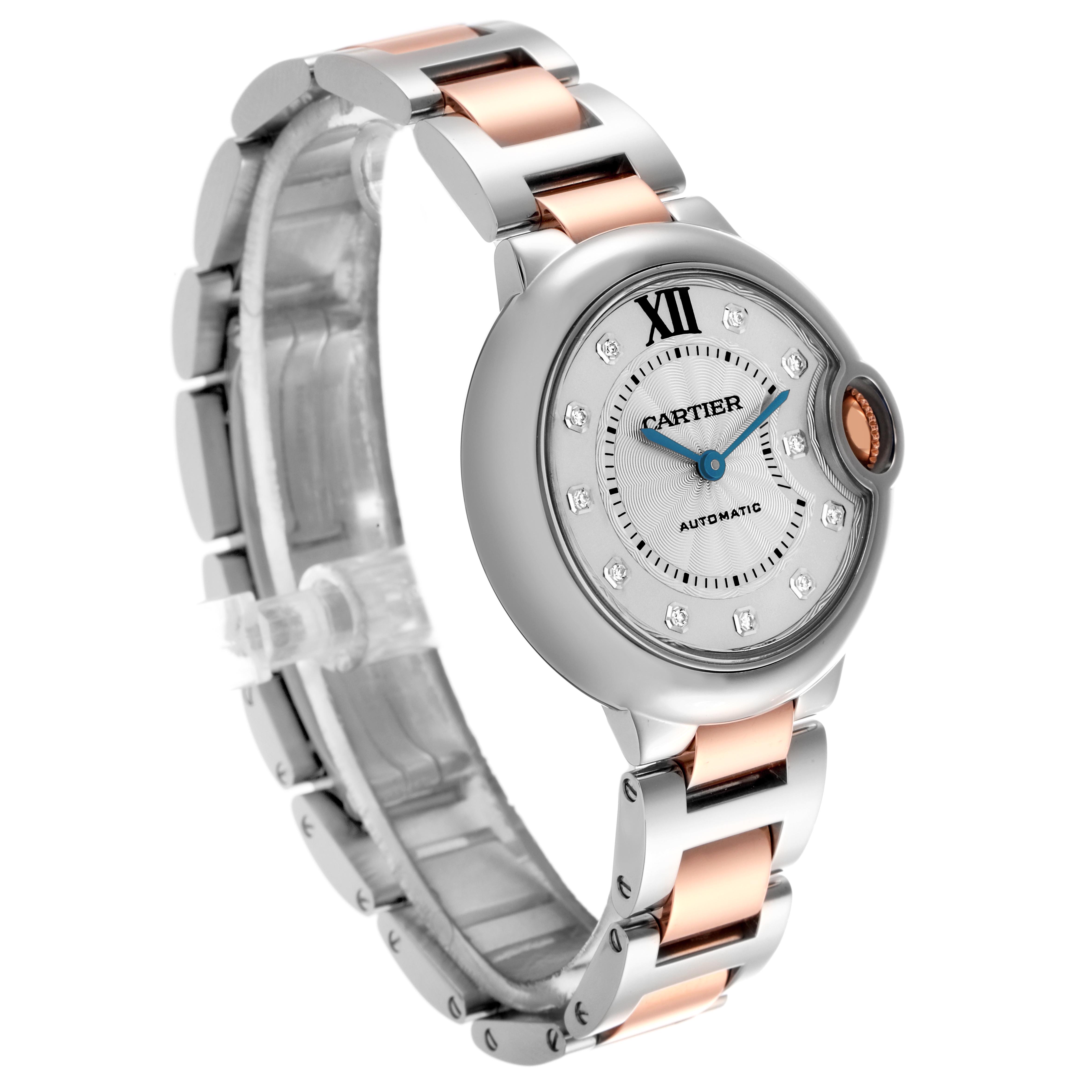 The Cartier Ballon Bleu WE902044 Women's Steel and Gold (two tone) Silver Dial WE902044 Women's Steel and Gold (two tone) Silver Dial watch is shown at a three-quarter angle, highlighting its dial, crown, and two-tone bracelet.