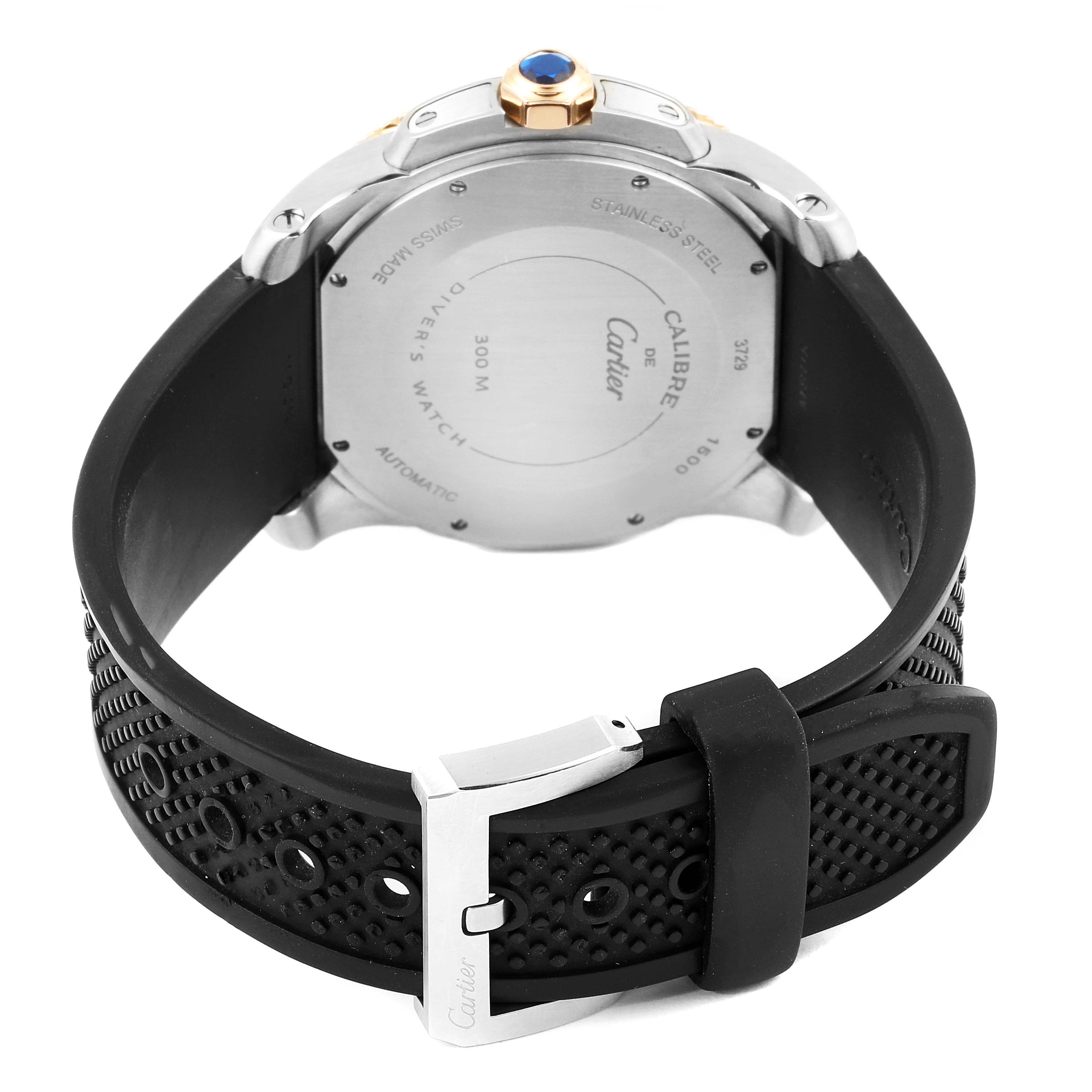 This image shows the back view of a Calibre de Cartier watch by Cartier, highlighting the watch
s case back and rubber strap with buckle.