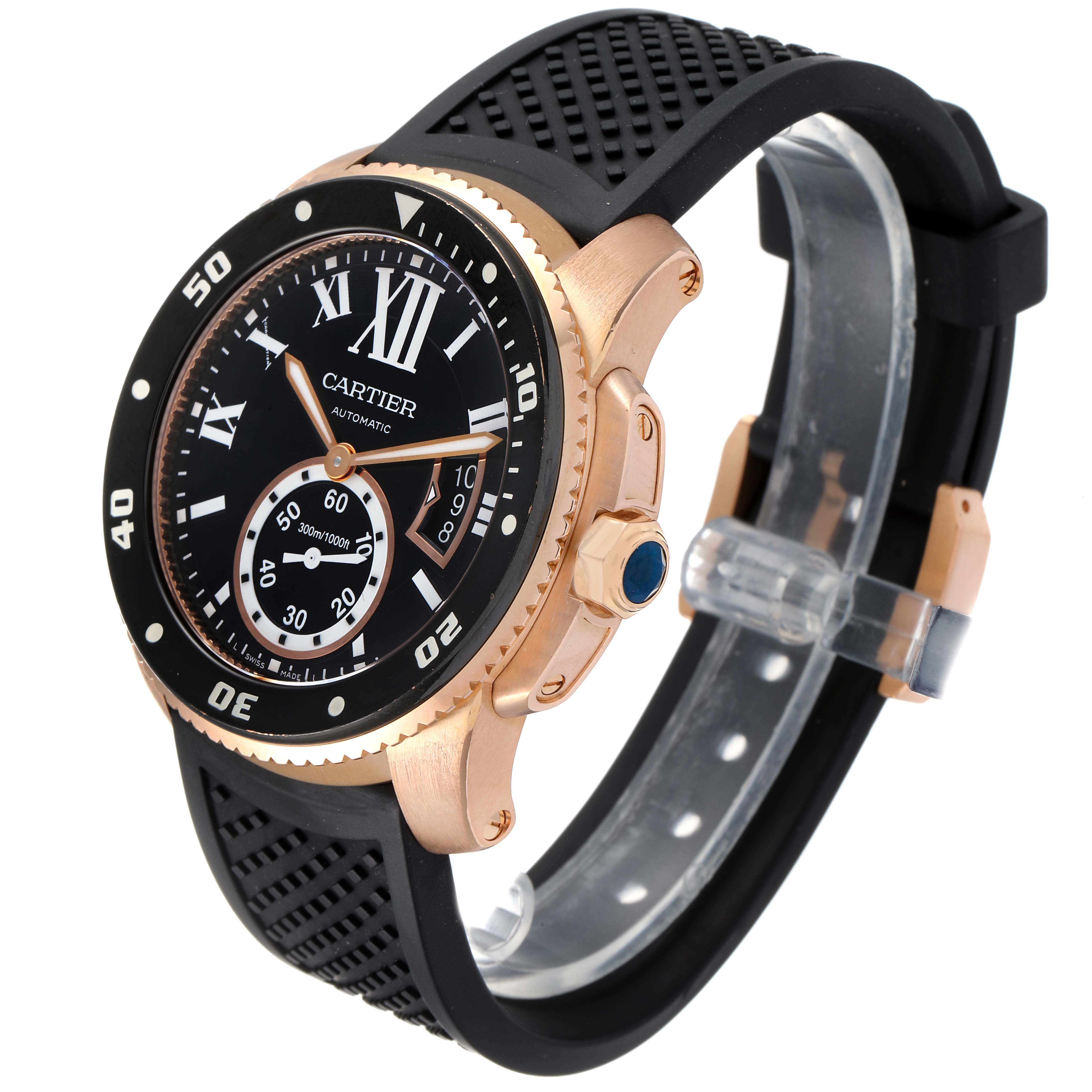 The image shows a side-front angle of a Calibre de Cartier watch by Cartier, featuring the watch face, bezel, crown, and rubber strap.