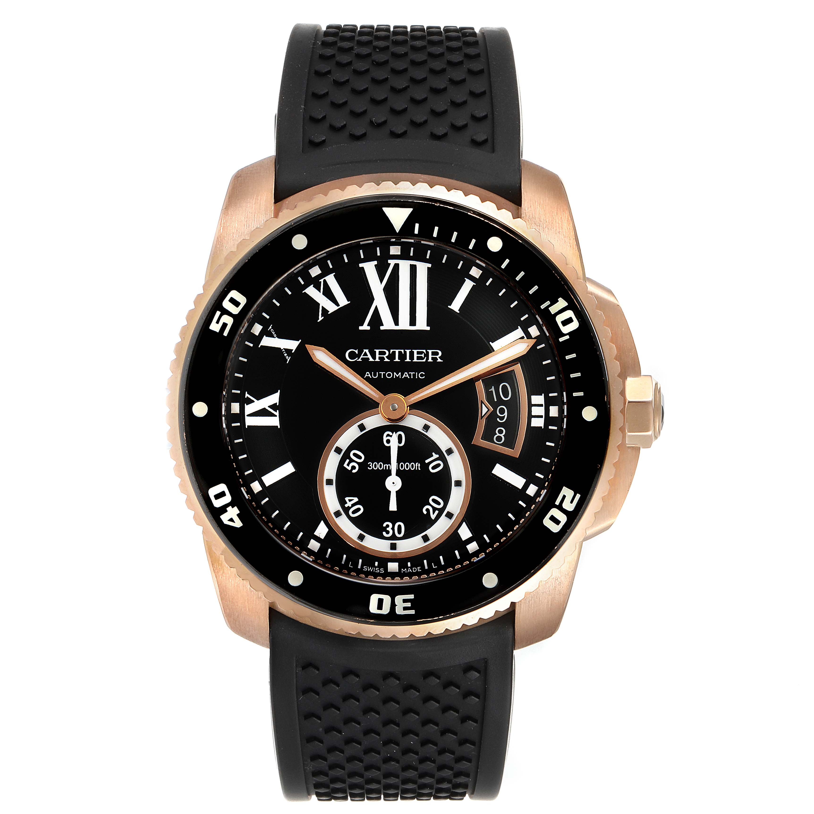 The image shows a frontal view of the Calibre de Cartier watch by Cartier, displaying its black dial and rubber strap.