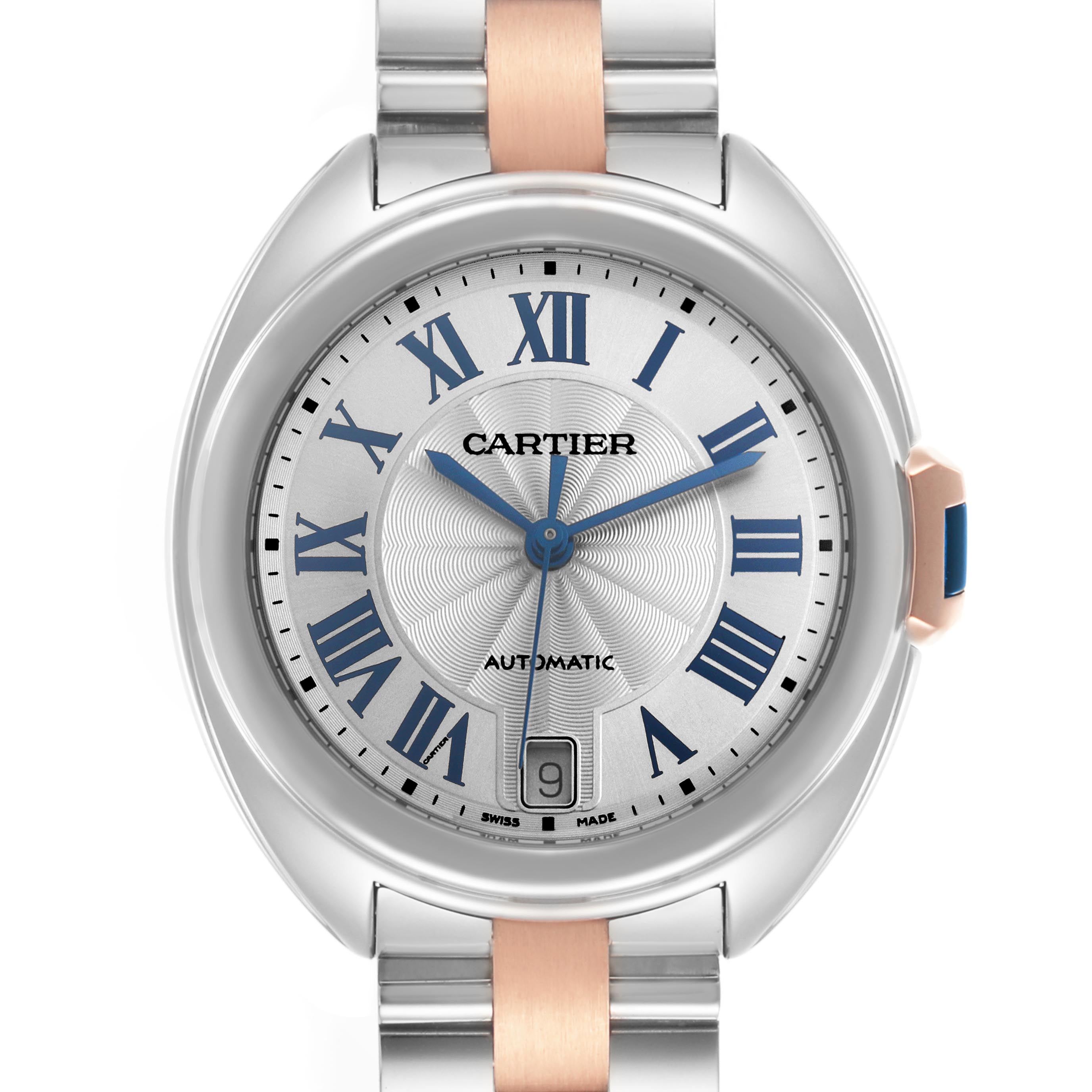 The Cartier Clé watch is shown from a top-down angle, featuring the dial, hands, and partial bracelet.