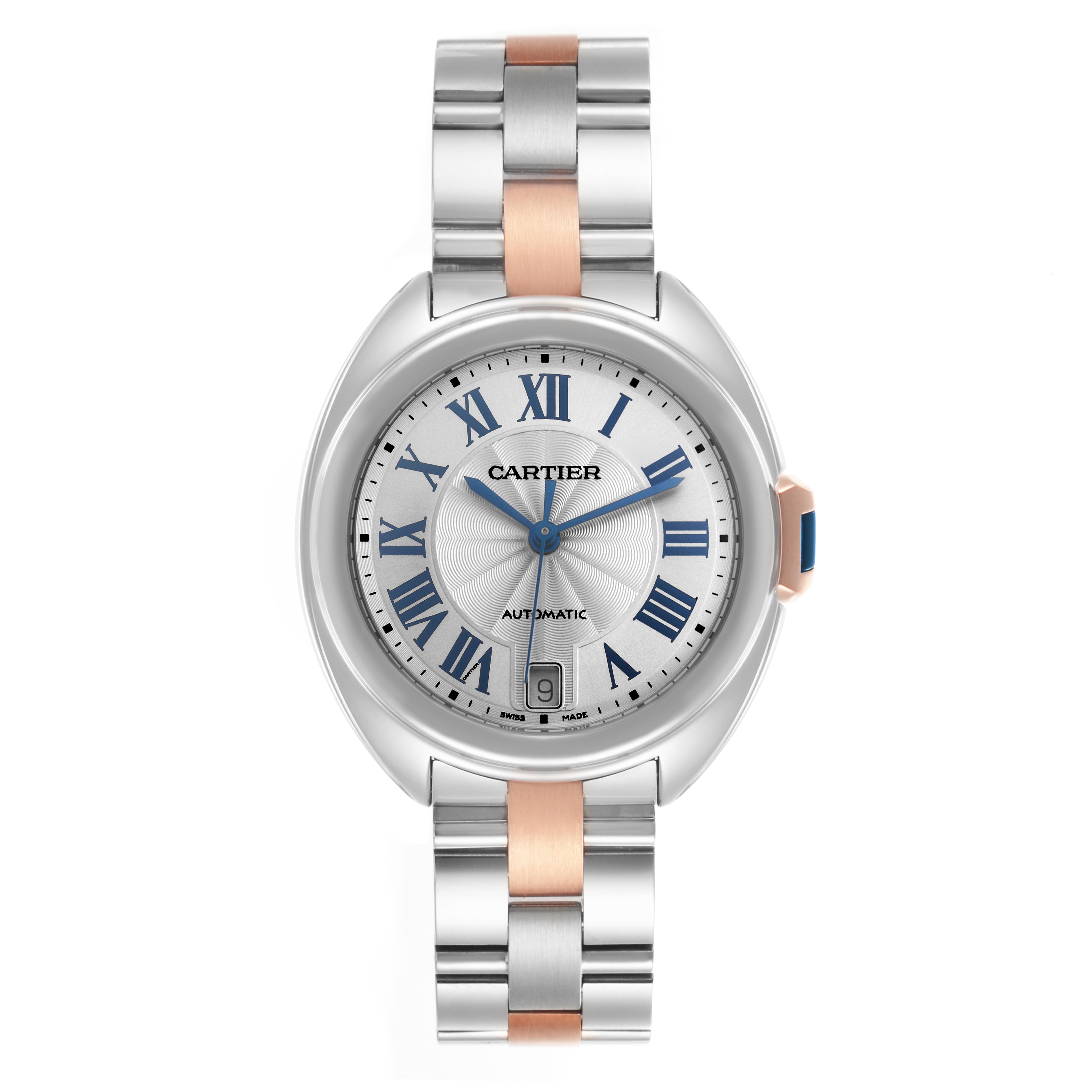 The image shows a Cartier Clé watch from a top-down angle, highlighting its face, bracelet, and crown.