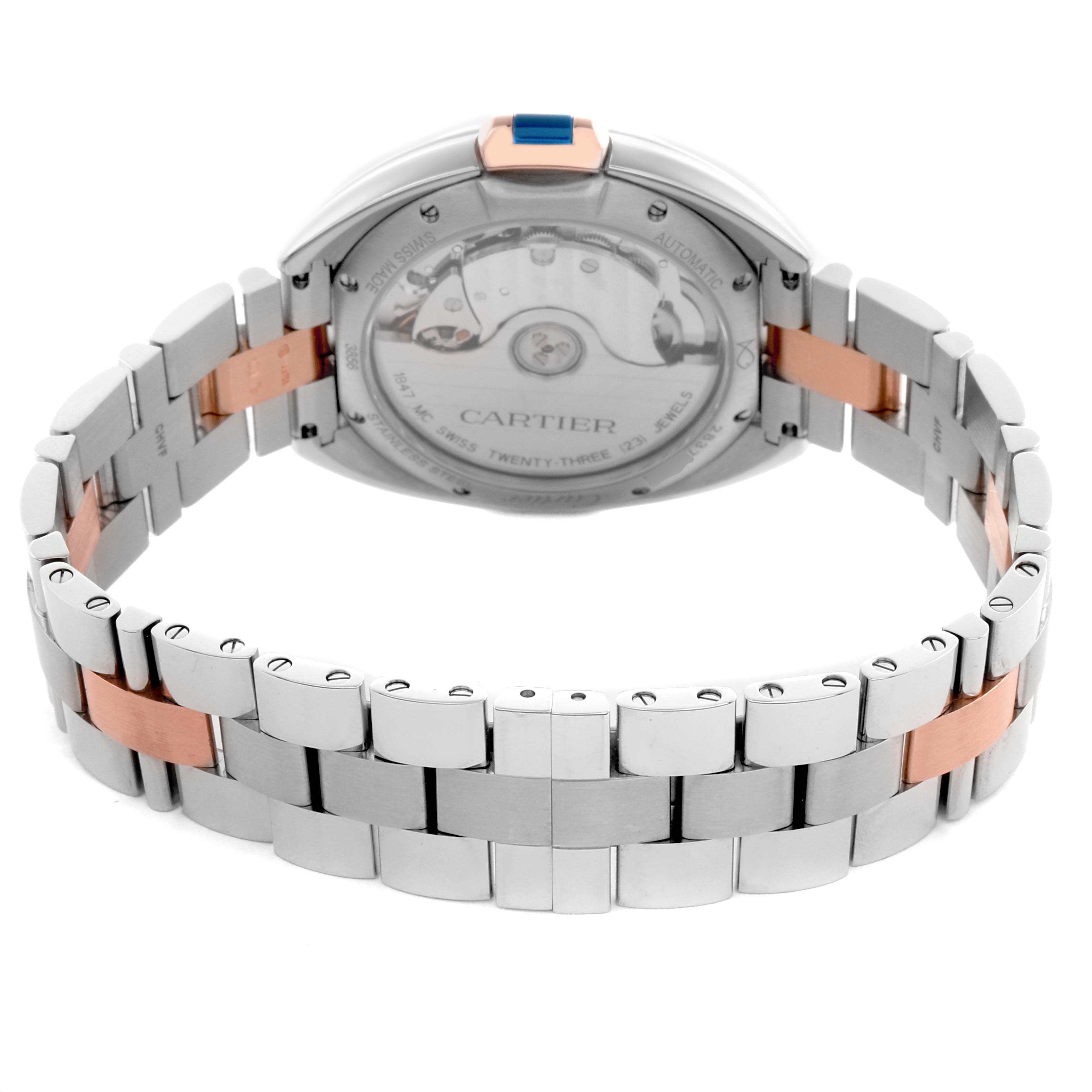 The image shows the back view of a Cartier Clé watch, highlighting its case back and bracelet links.