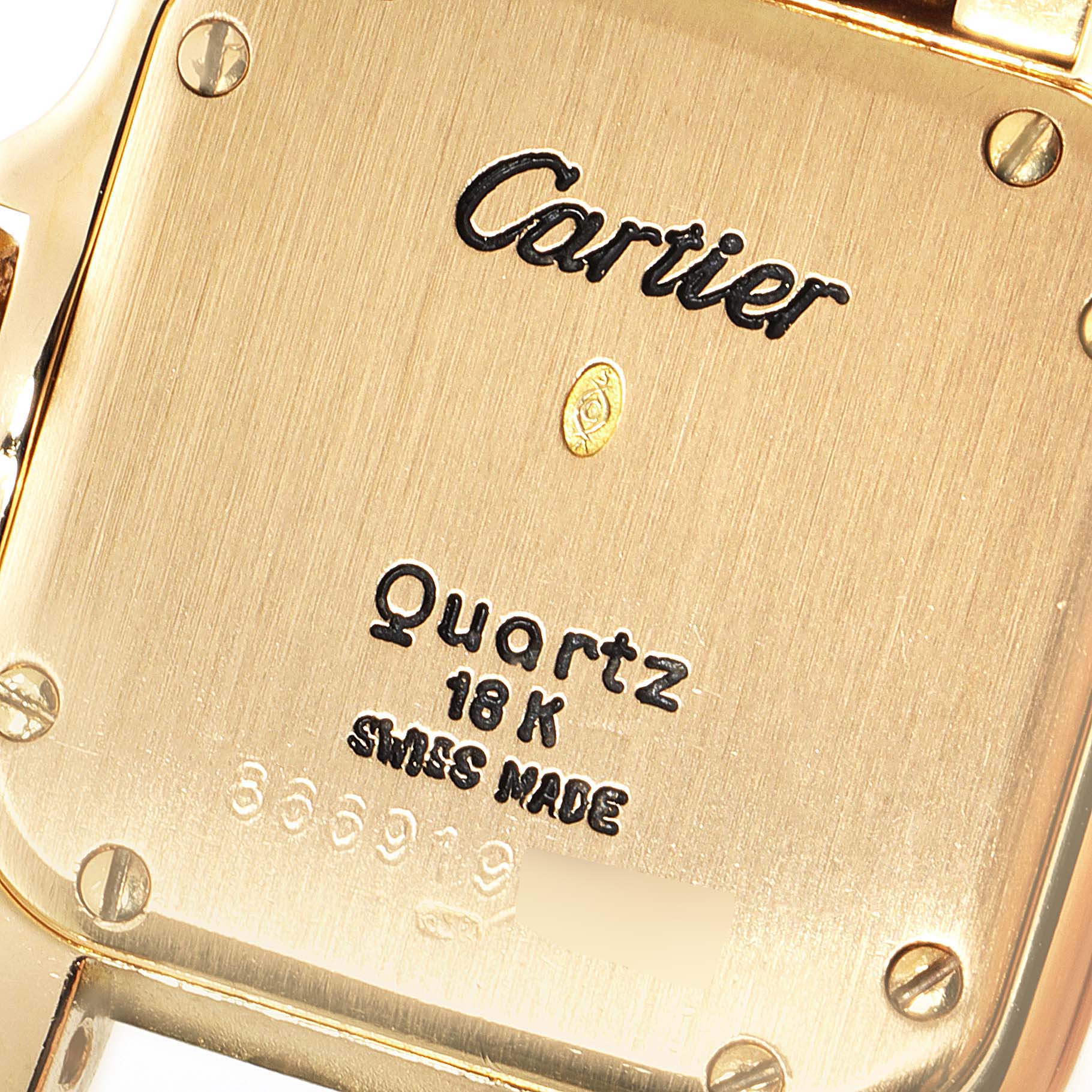 The image shows the back of a Cartier Panthere Women's Yellow Gold Silver Dial Women's Yellow Gold Silver Dial watch, highlighting its inscriptions and screws.