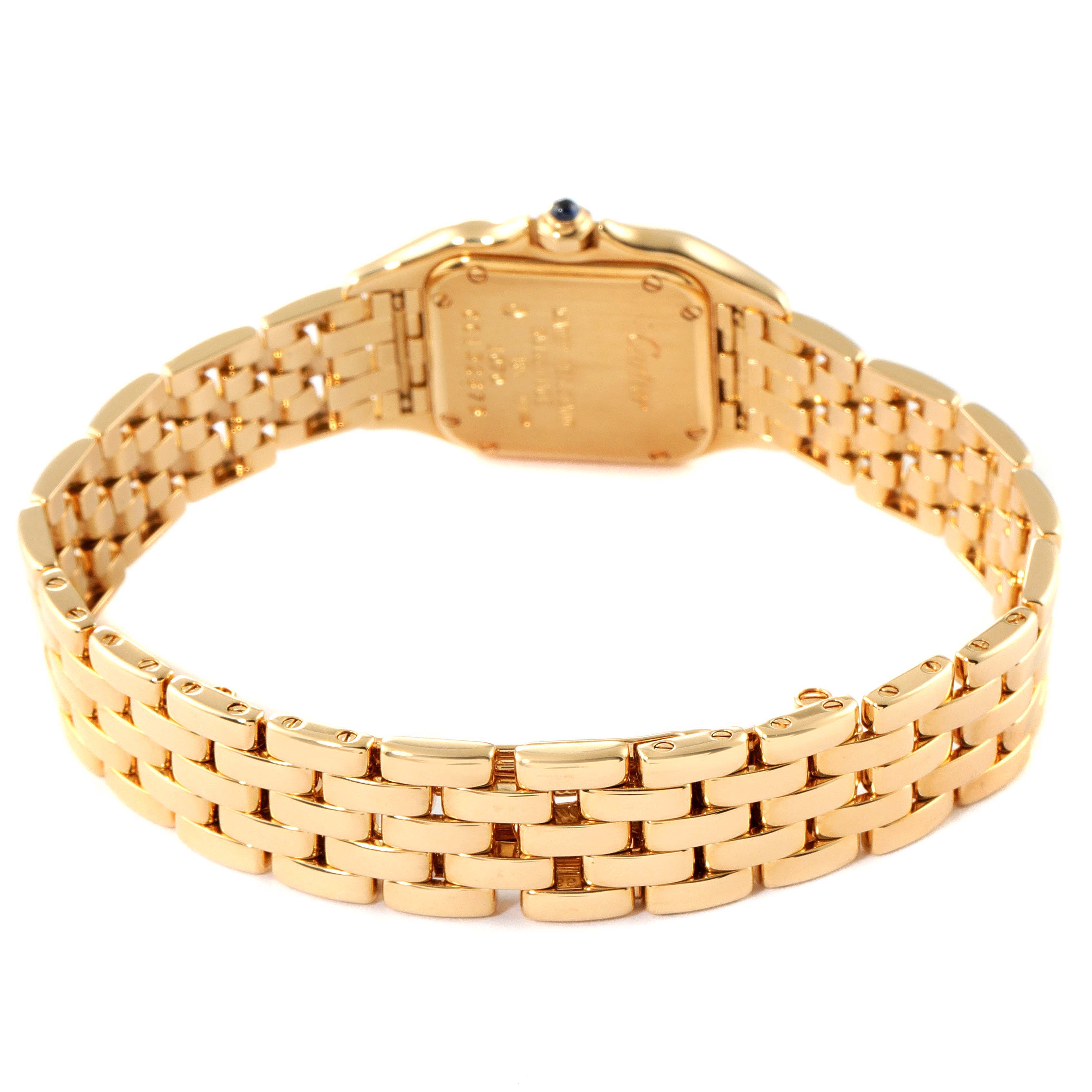 The image shows the back of a gold Panthere de Cartier watch, highlighting its case back and bracelet.