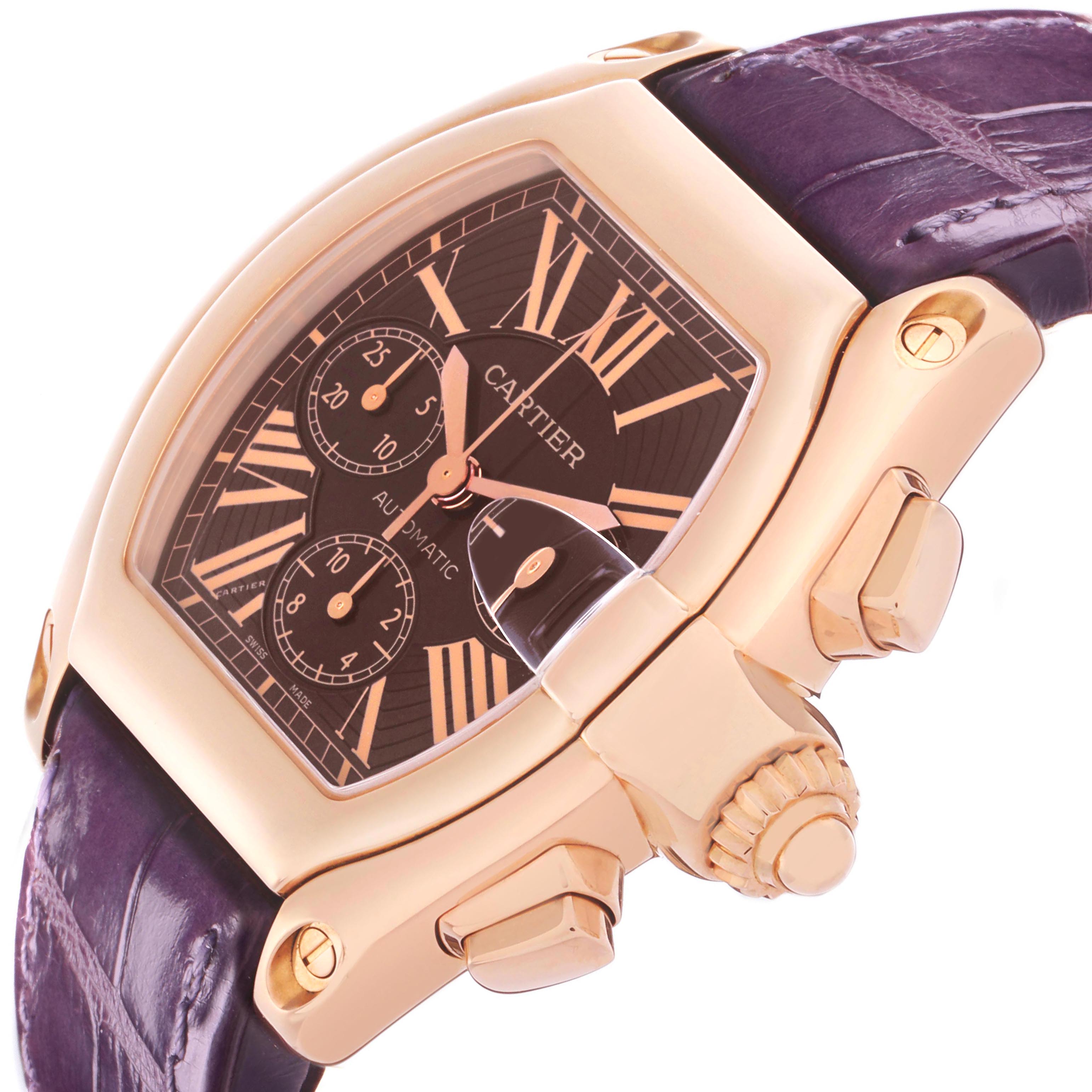 The Cartier Roadster W62042Y5 Men's Rose Gold Brown Dial watch is shown from a side angle, highlighting its face, crown, and purple strap.