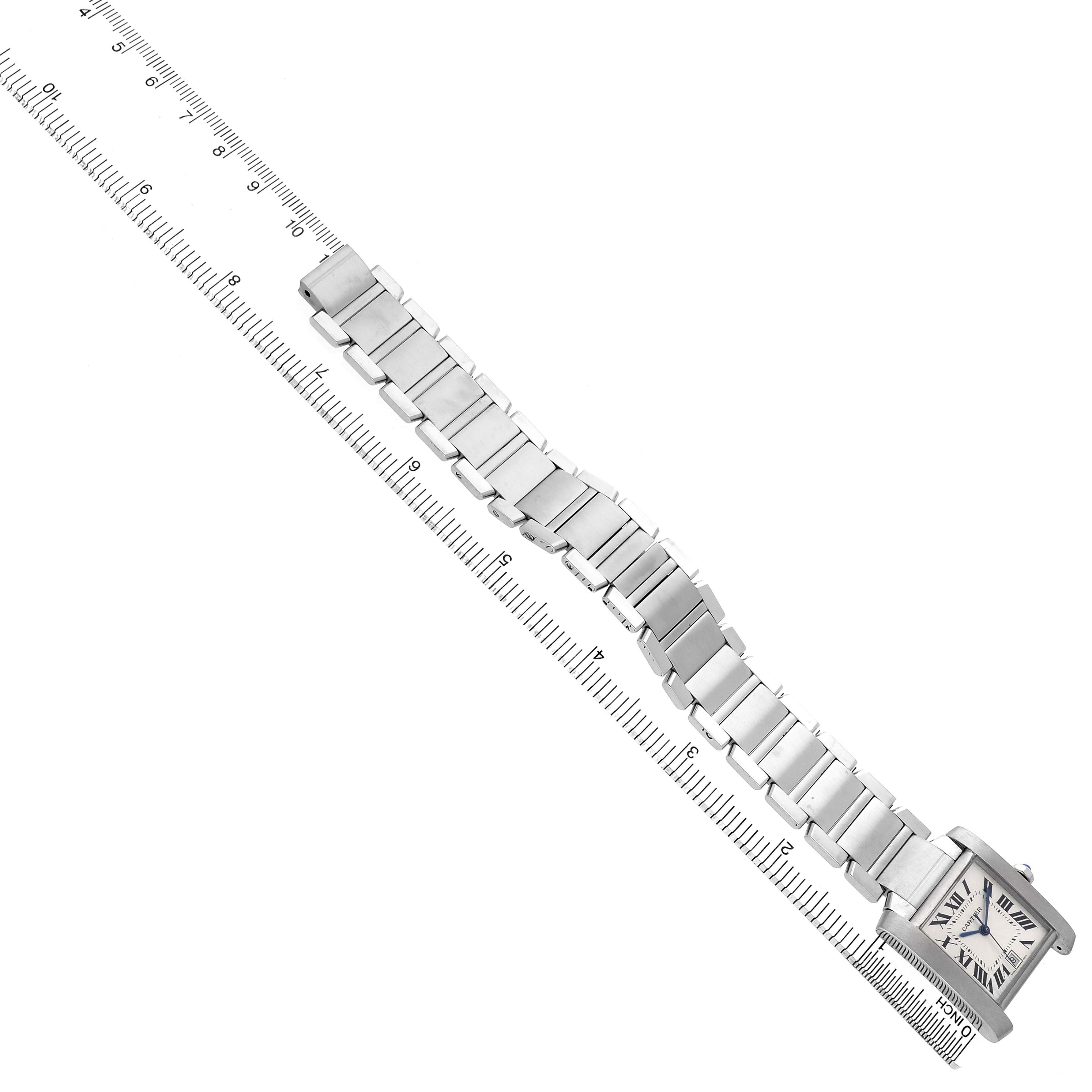 The Cartier Tank Francaise W51002Q3 Men's Stainless Steel Silver Dial watch is displayed diagonally, showing the bracelet and case alongside a measuring scale.