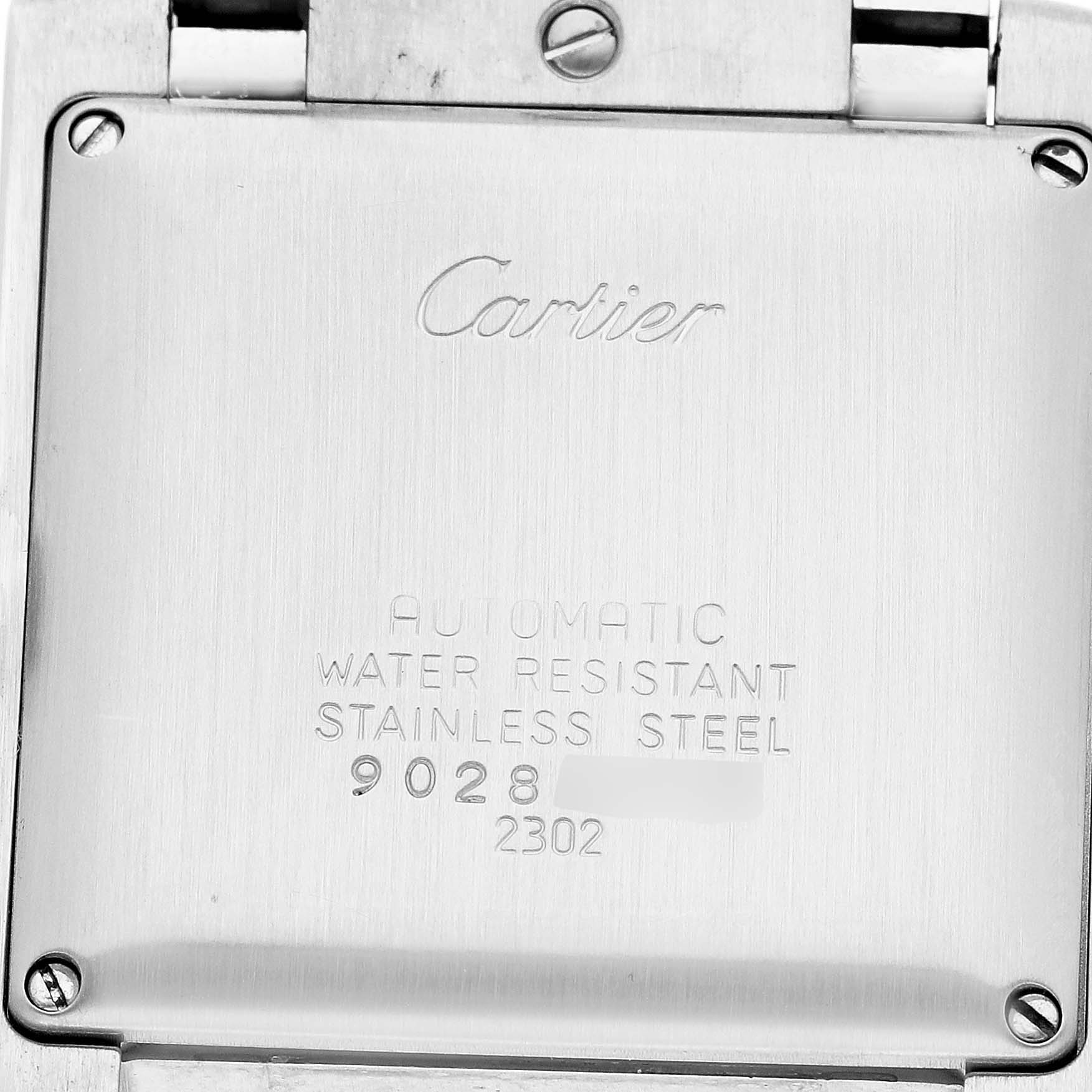 The image shows the back of a Cartier Tank Francaise W51002Q3 Men's Stainless Steel Silver Dial watch, highlighting the engraved details and screws.