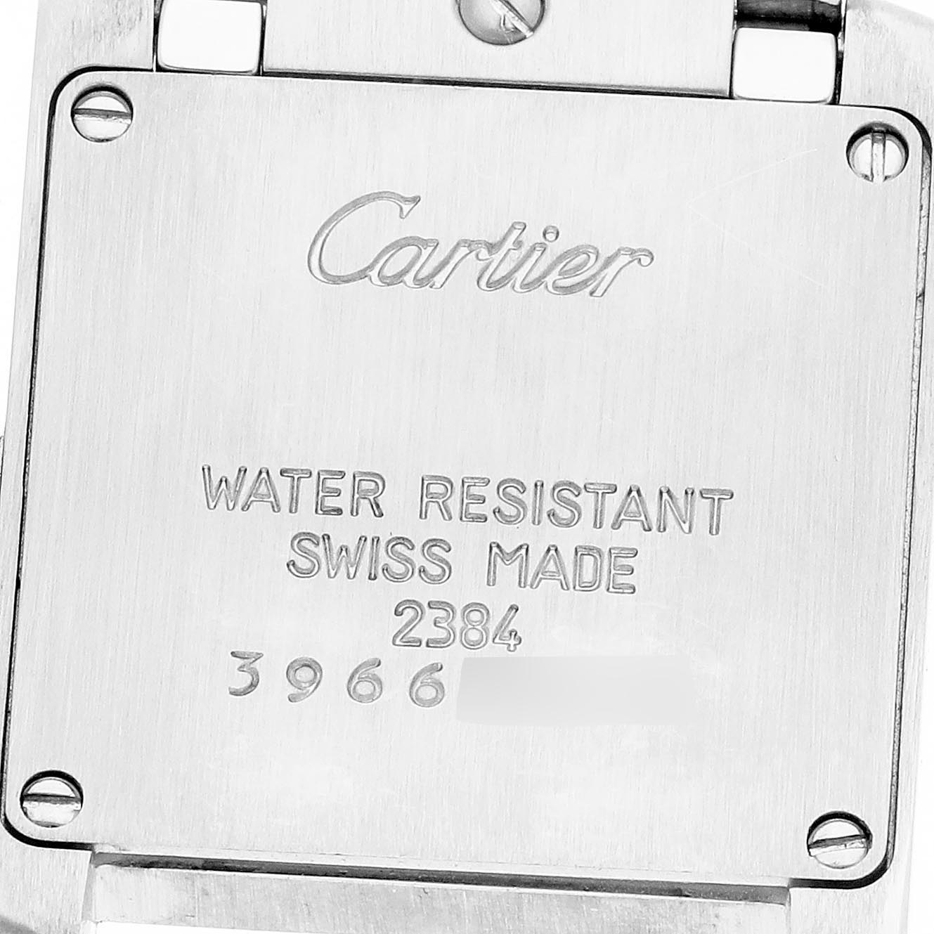 This image shows the back case of the Cartier Tank Française watch with engraved details.