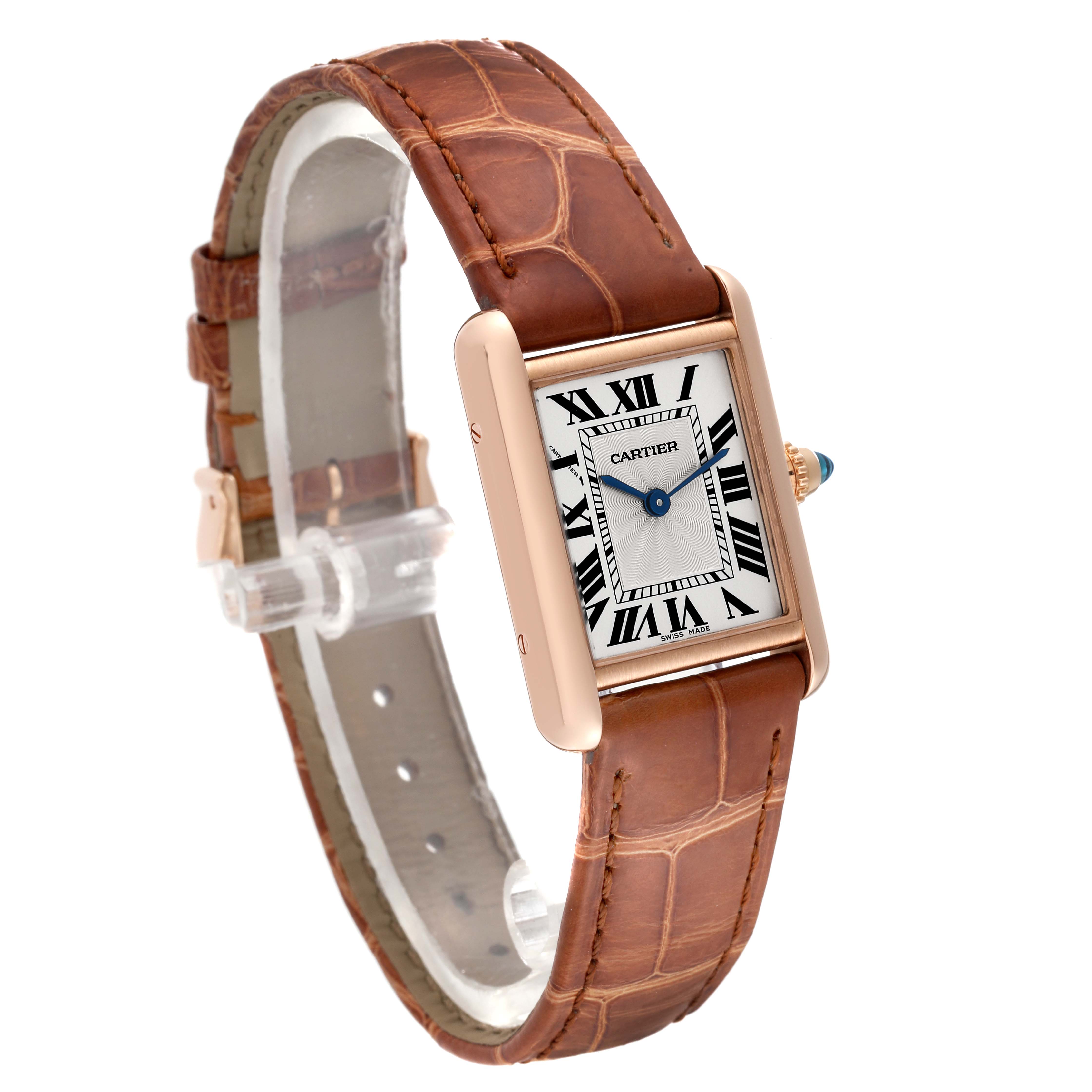 The image shows a Tank Louis Cartier watch at a three-quarter angle, highlighting its rectangular face and brown leather strap.