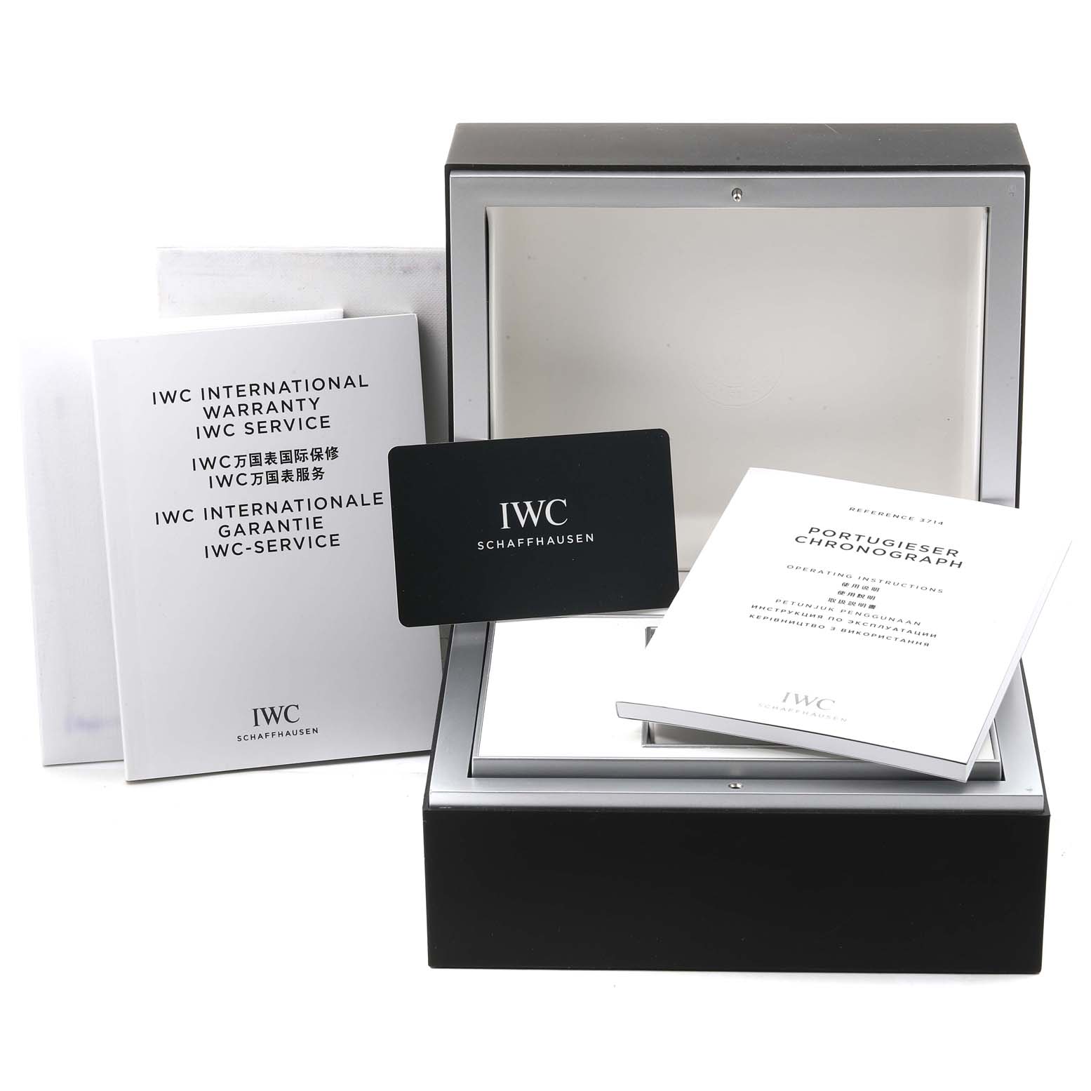 This image shows the box and documents for an IWC Portuguese IW371491 Men's Stainless Steel Blue Dial IW371491 Men's Stainless Steel Blue Dial model watch, including a warranty card and manuals.