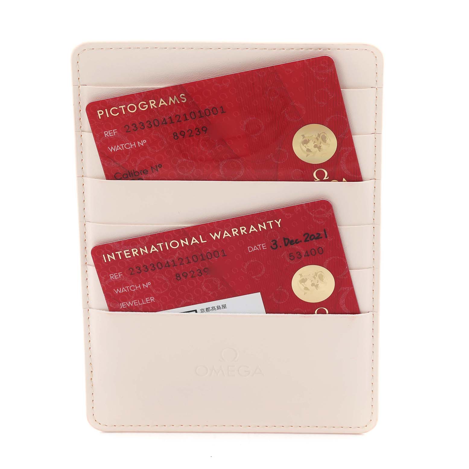 The image shows Omega Seamaster 233.30.41.21.01.001 Men's Stainless Steel Black Dial 233.30.41.21.01.001 Men's Stainless Steel Black Dial model warranty and pictogram cards in a cream cardholder.