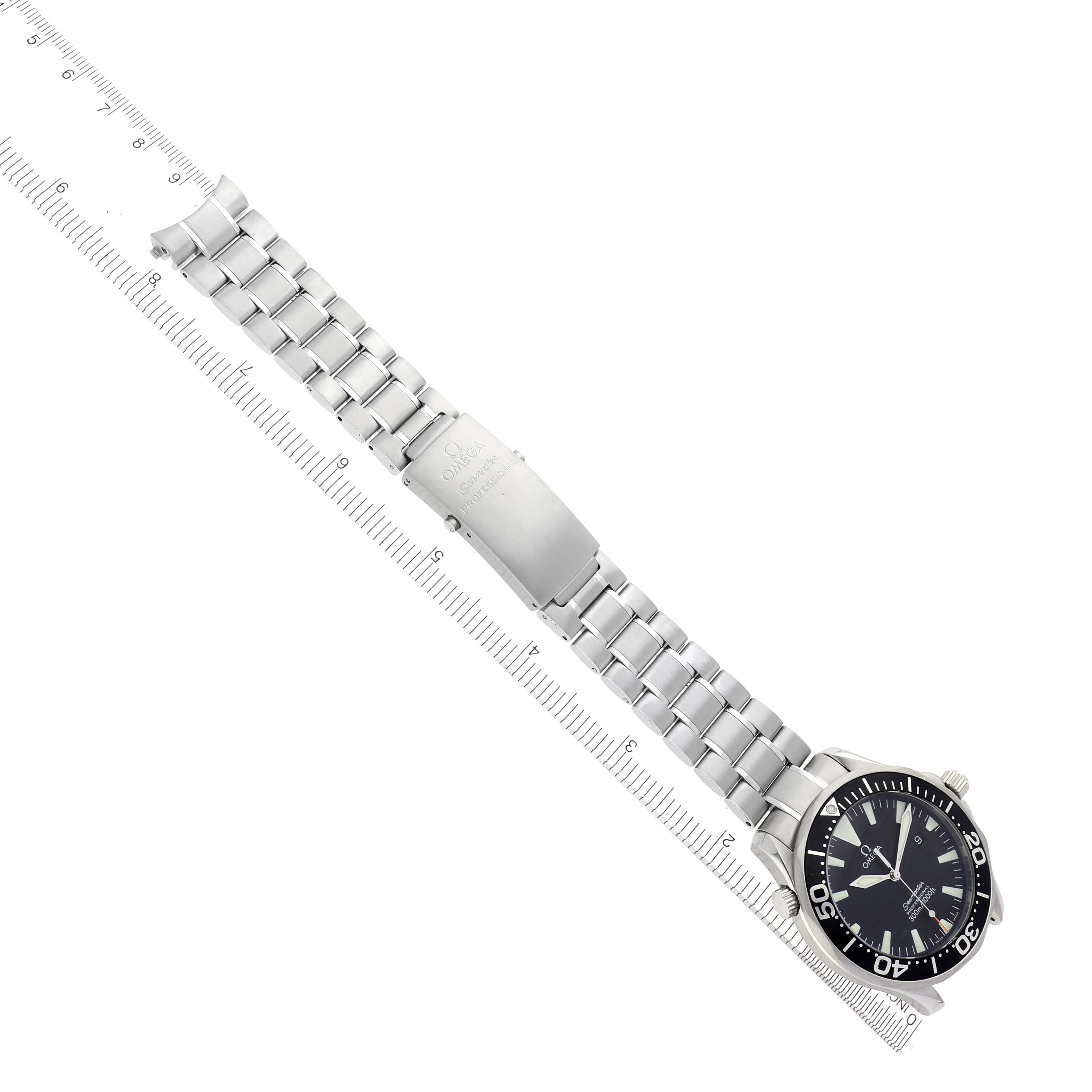 The Omega Seamaster 2264.50.00 Men
s Stainless Steel Black Dial 2264.50.00 Men
s Stainless Steel Black Dial watch is displayed flat with its full bracelet and clasp visible alongside a ruler for scale.