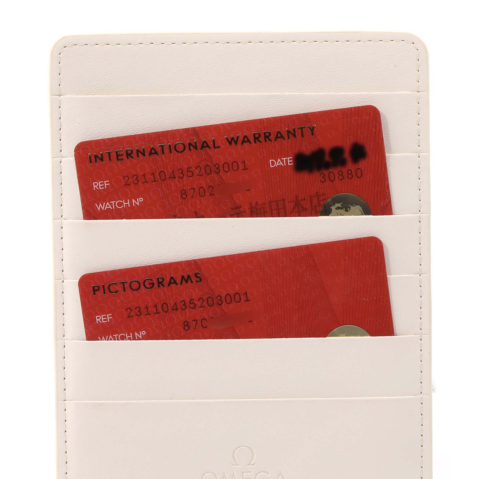 The image shows two red cards labeled "INTERNATIONAL WARRANTY" and "PICTOGRAMS" in a white cardholder for an Omega Aqua Terra 231.10.43.52.03.001 Men's Stainless Steel Blue Dial 231.10.43.52.03.001 Men's Stainless Steel Blue Dial watch.