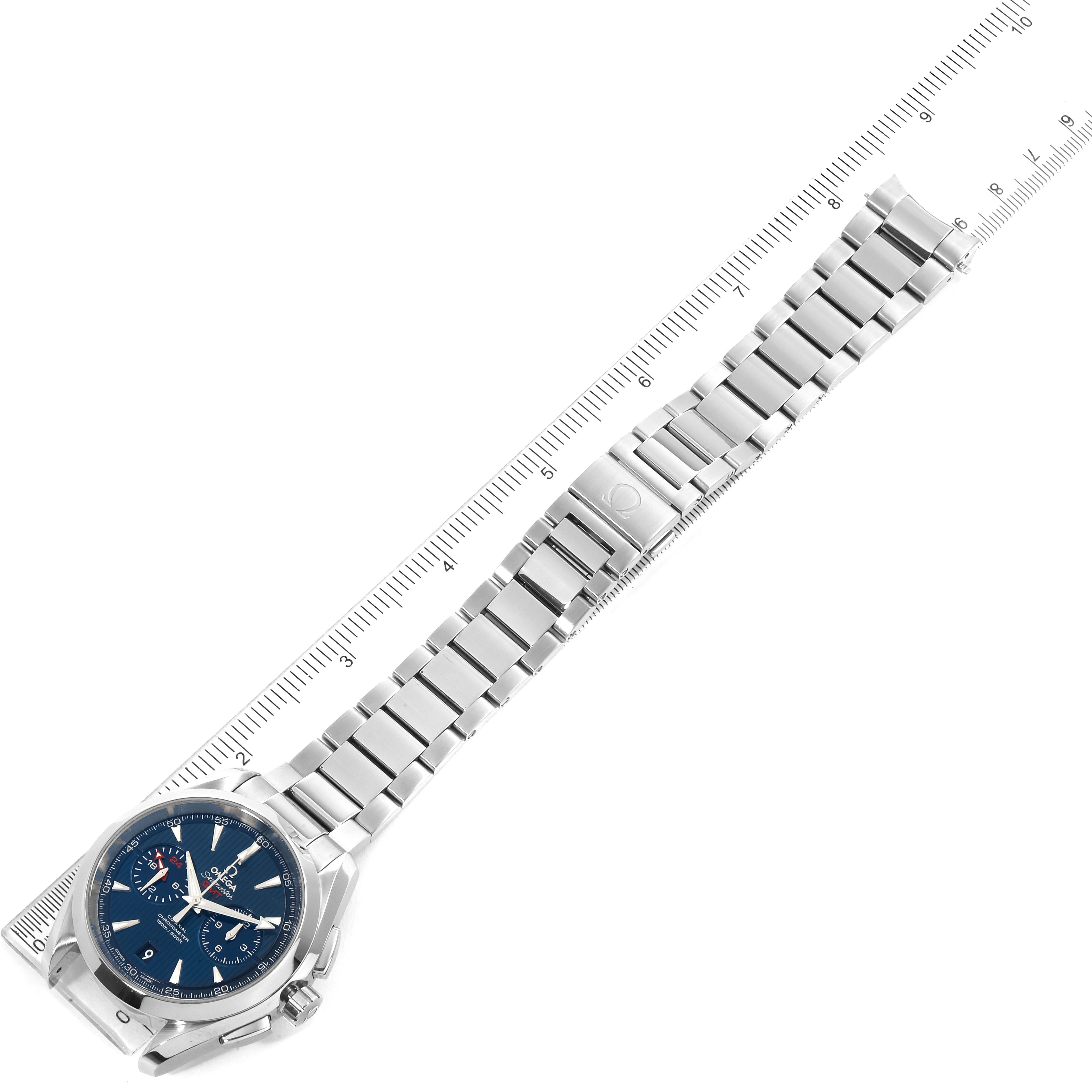 The image shows an Omega Aqua Terra 231.10.43.52.03.001 Men's Stainless Steel Blue Dial 231.10.43.52.03.001 Men's Stainless Steel Blue Dial watch laid flat alongside a ruler, showcasing its face and metal bracelet fully extended.