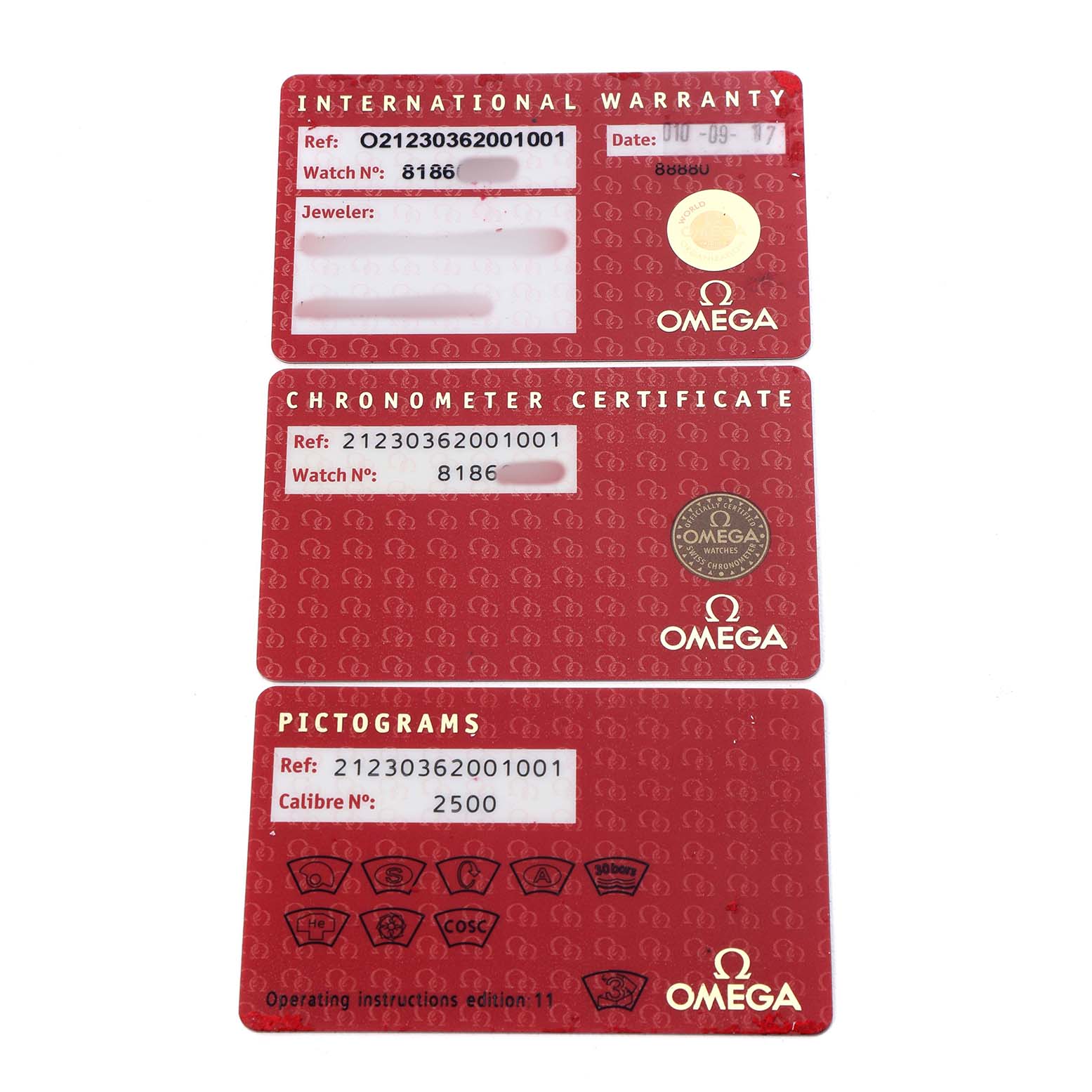 The image shows three red cards for an Omega Seamaster 212.30.36.20.01.001 Men's Stainless Steel Black Dial: an international warranty, a chronometer certificate, and pictograms.