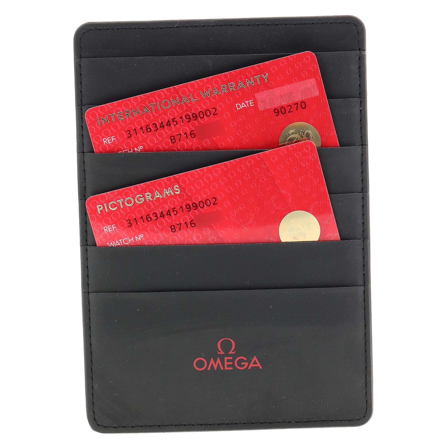 The image shows Omega Speedmaster 311.63.44.51.99.002 Men
s Ceramic Grey Dial 311.63.44.51.99.002 Men
s Ceramic Grey Dial warranty and pictogram cards in a black Omega-branded holder, viewed from above.