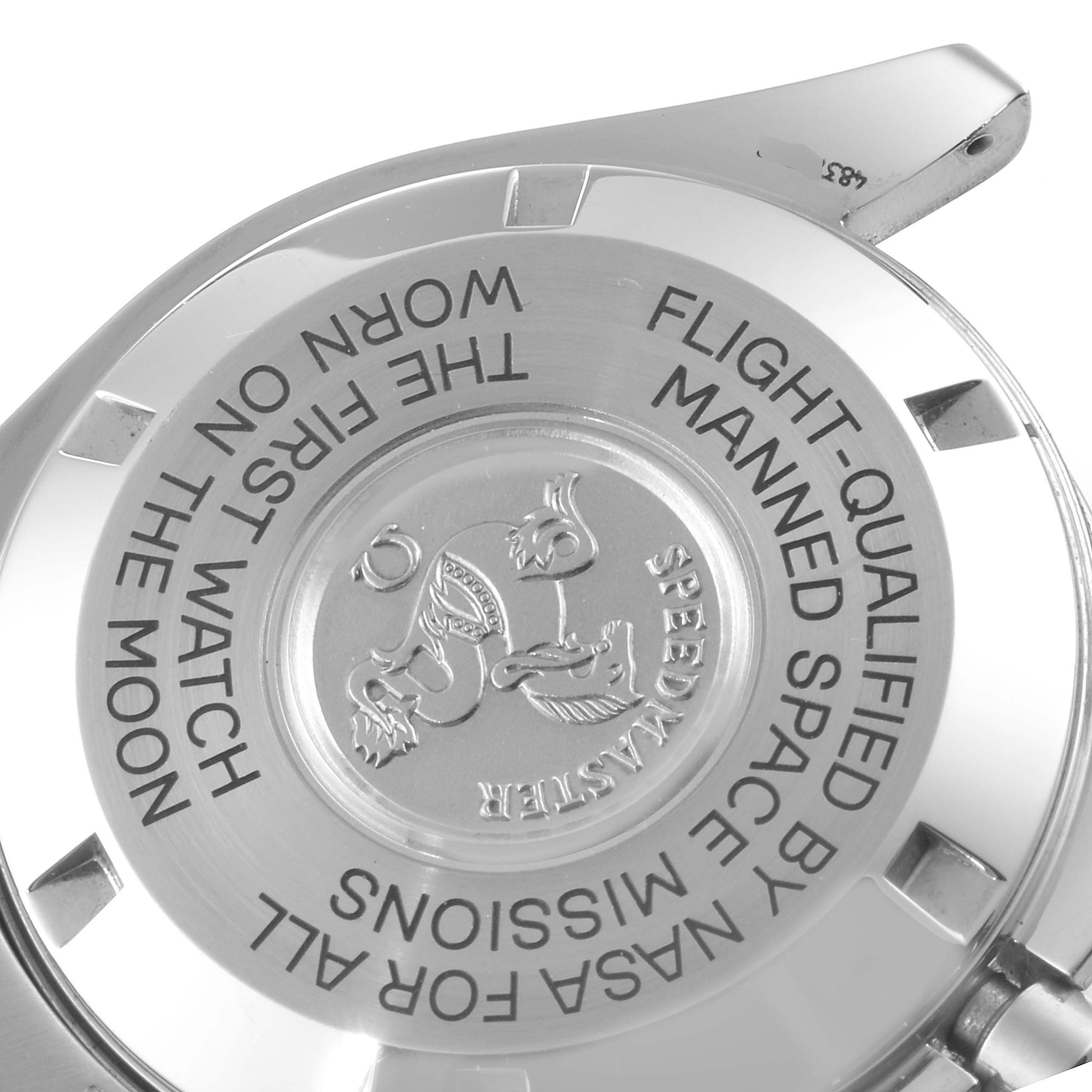 This image shows the back cover of an Omega Speedmaster 3597.04.00 Men's Stainless Steel Black Dial 3597.04.00 Men's Stainless Steel Black Dial watch, displaying engraved text and the brand logo.