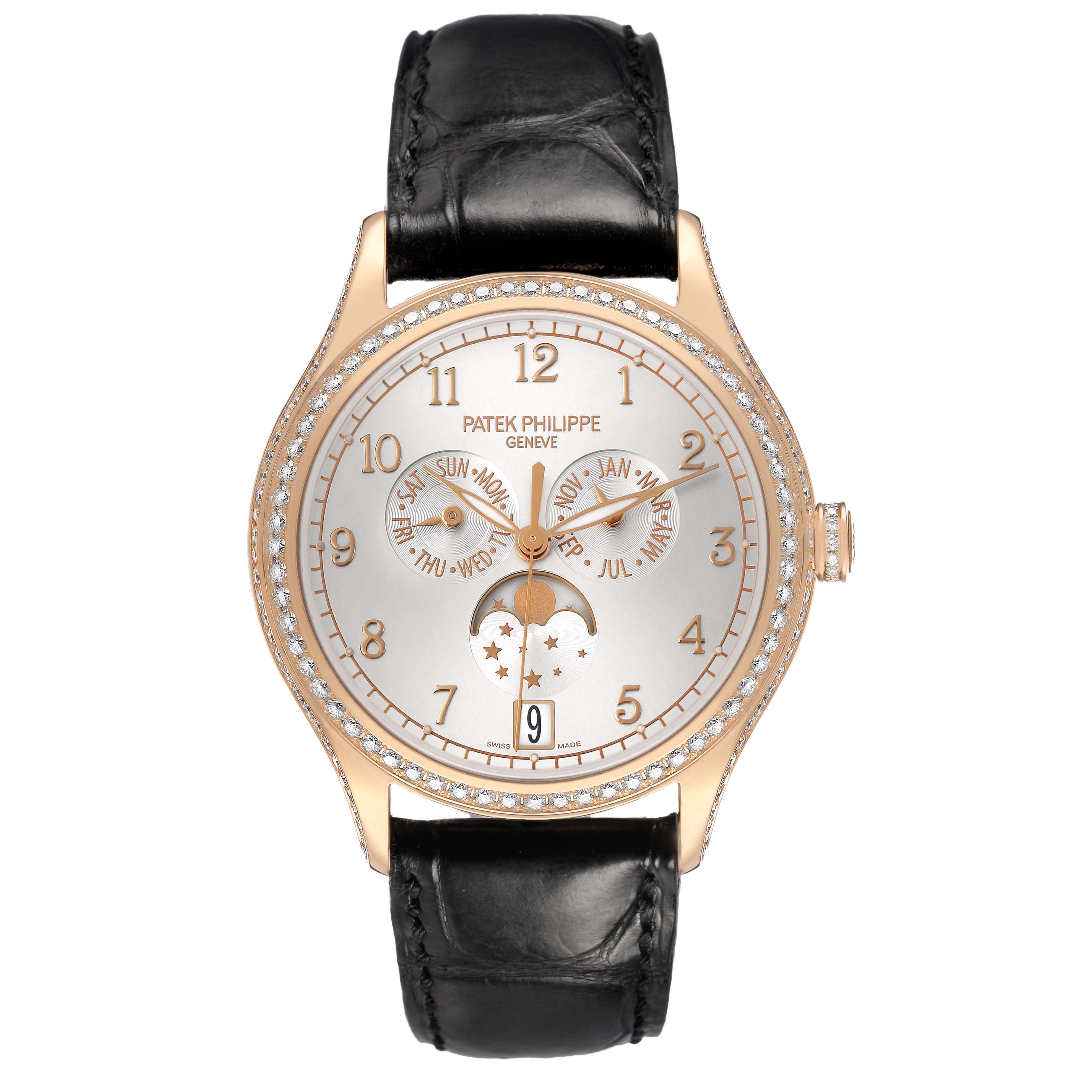 The Patek Philippe Complications 4947R-001 Men's Rose Gold Silver Dial watch is shown from a top-down angle, highlighting its face, dial, and the black strap.