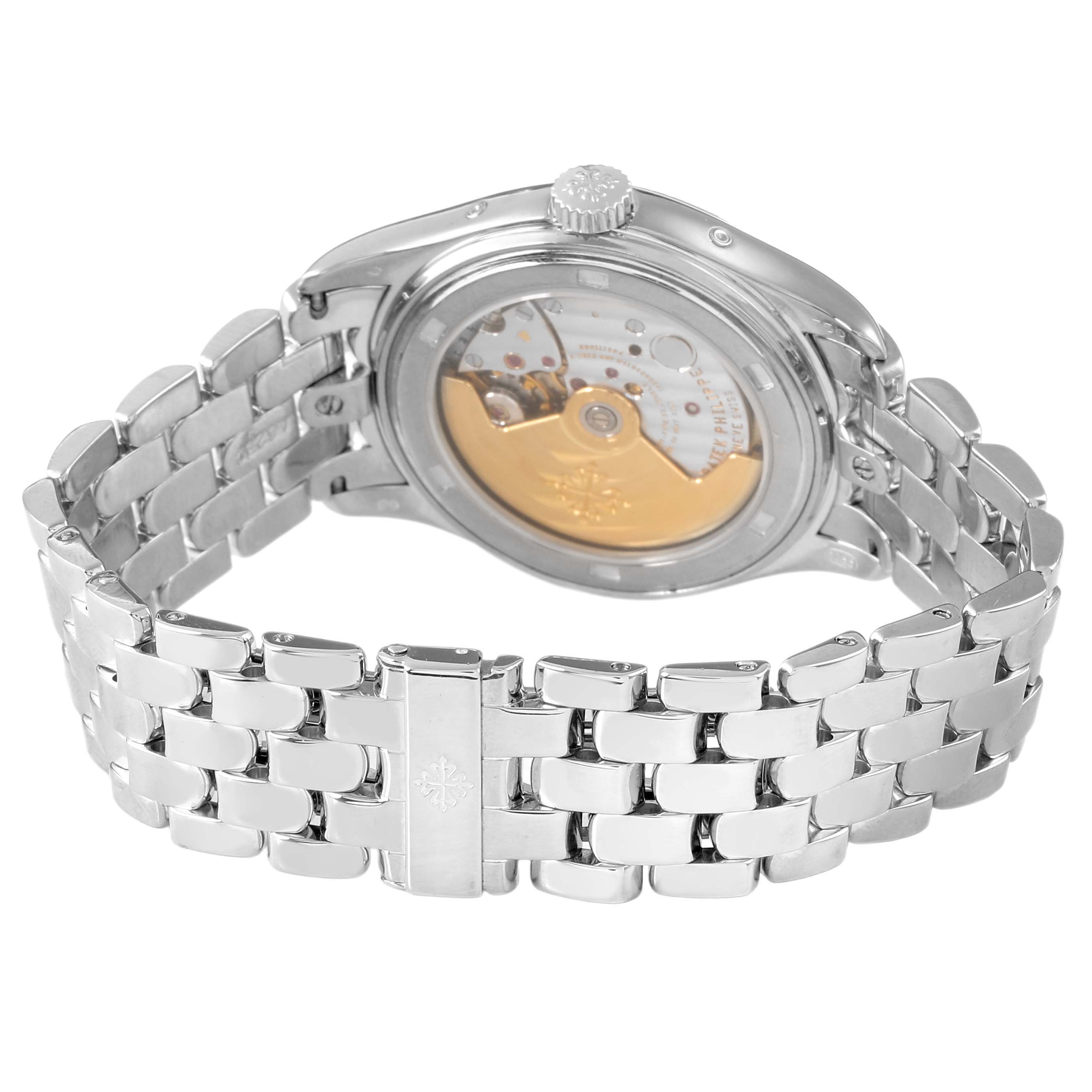 The image shows the back view of a Patek Philippe Complications 5037G 5037 Men's White Gold White Dial watch, highlighting the case back and the metal bracelet.