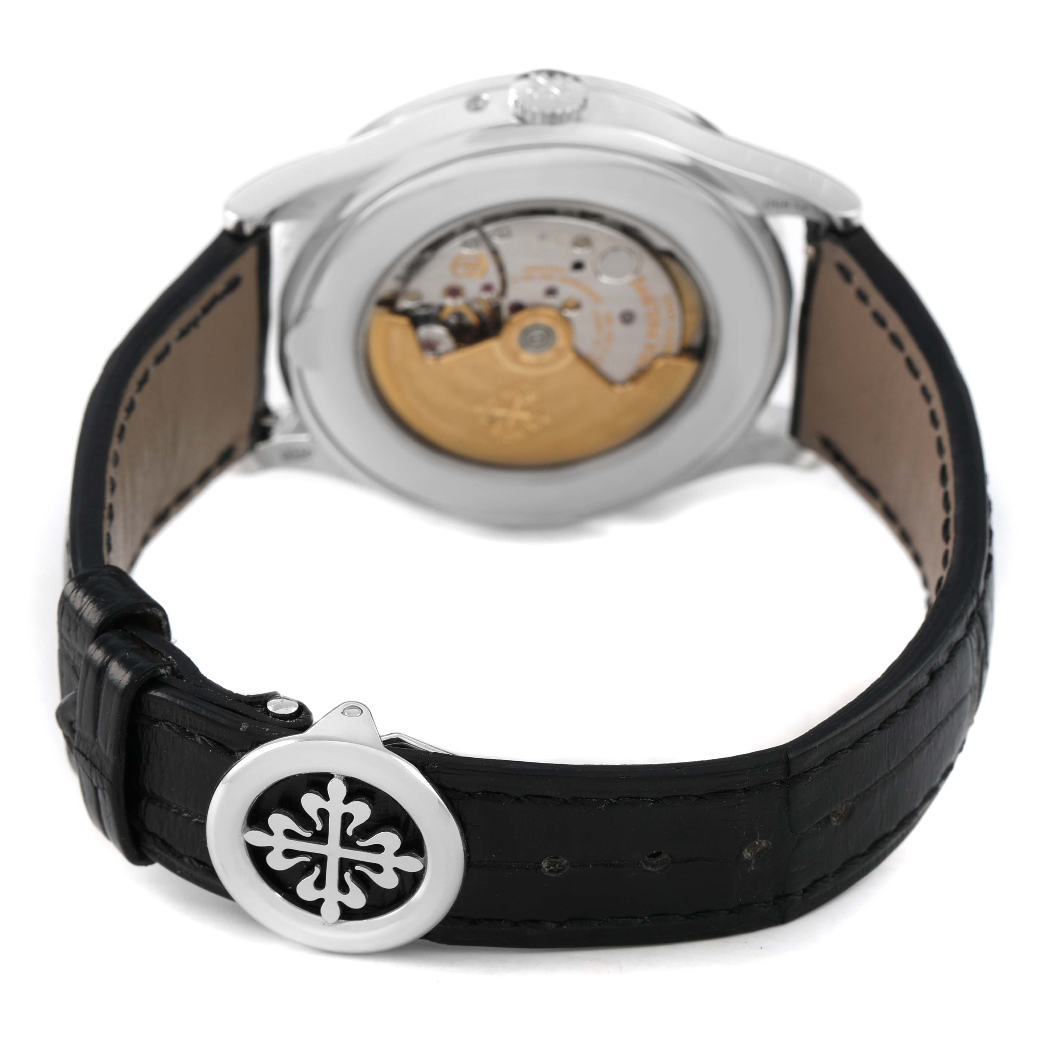 The Patek Philippe Complications 5496P-014 Men's Platinum Brown Dial watch is shown from the back, highlighting the movement and black leather strap with buckle.