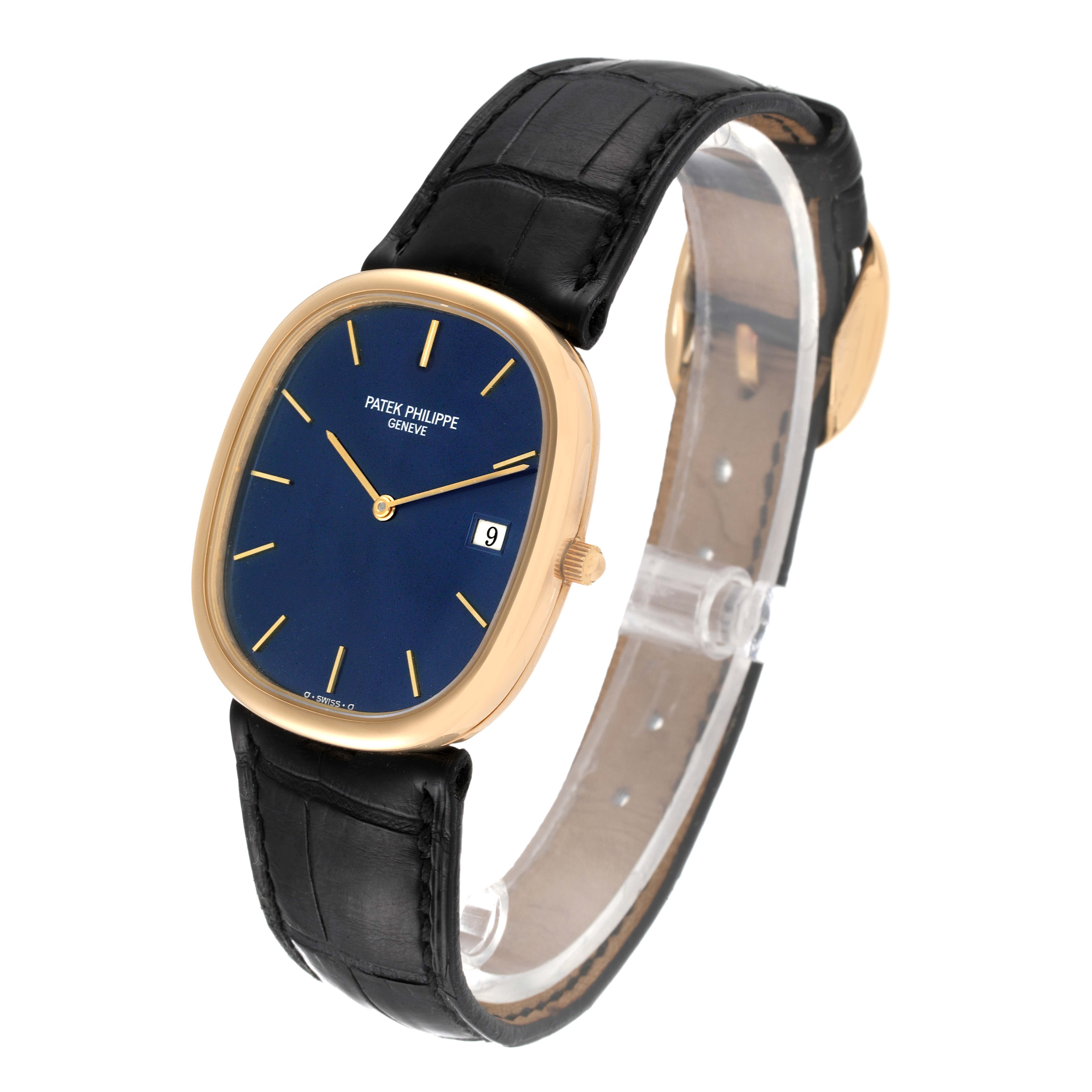 The image shows a side angle of a Patek Philippe Golden Ellipse 3747 Men's Yellow Gold Blue Dial 3747 Men's Yellow Gold Blue Dial watch, highlighting the blue dial, gold case, date display, and black strap.