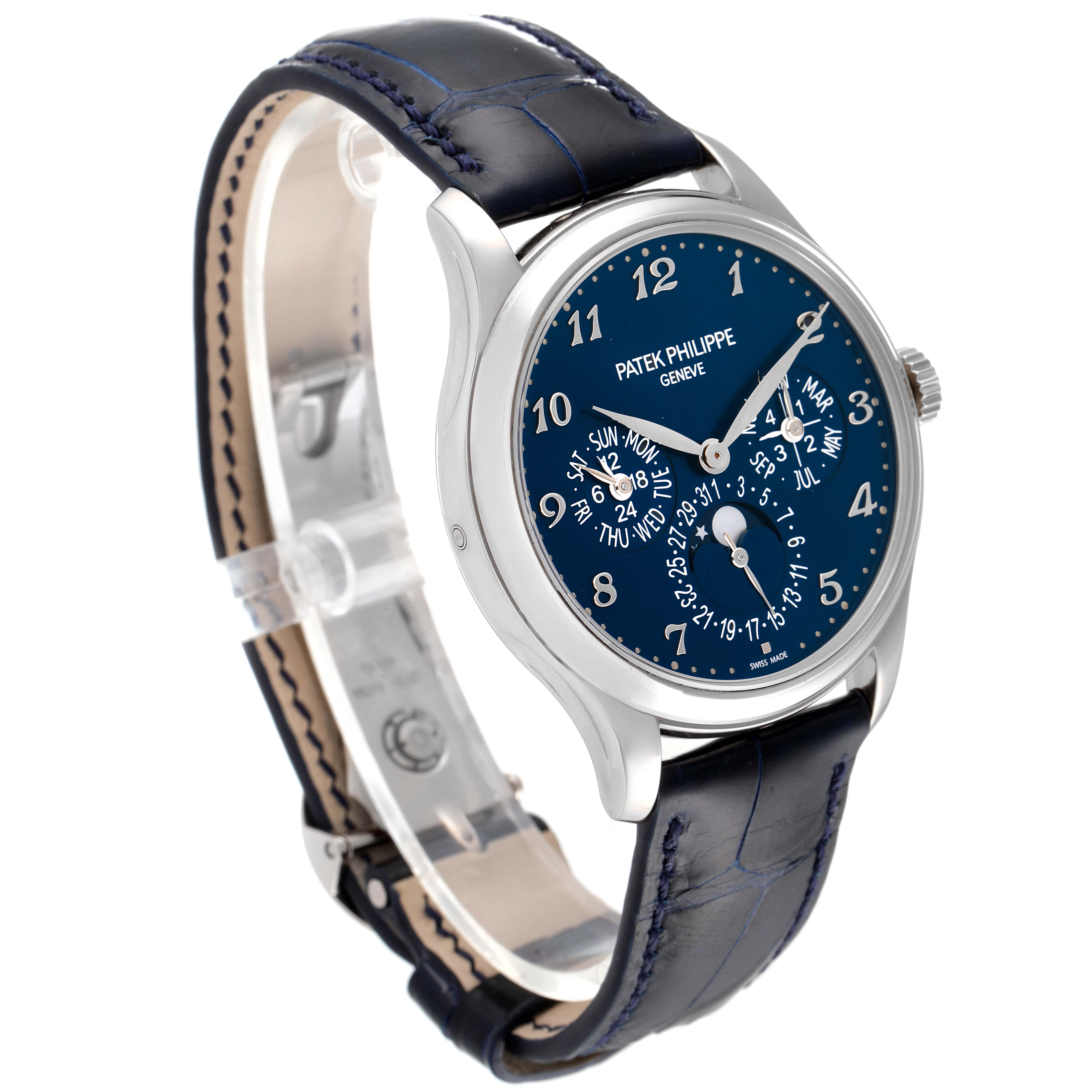 The image shows a Patek Philippe Complications 5327G-001 Men
s White Gold Blue Dial 5327G-001 Men
s White Gold Blue Dial model watch at a slight side angle, highlighting its blue dial and leather strap.