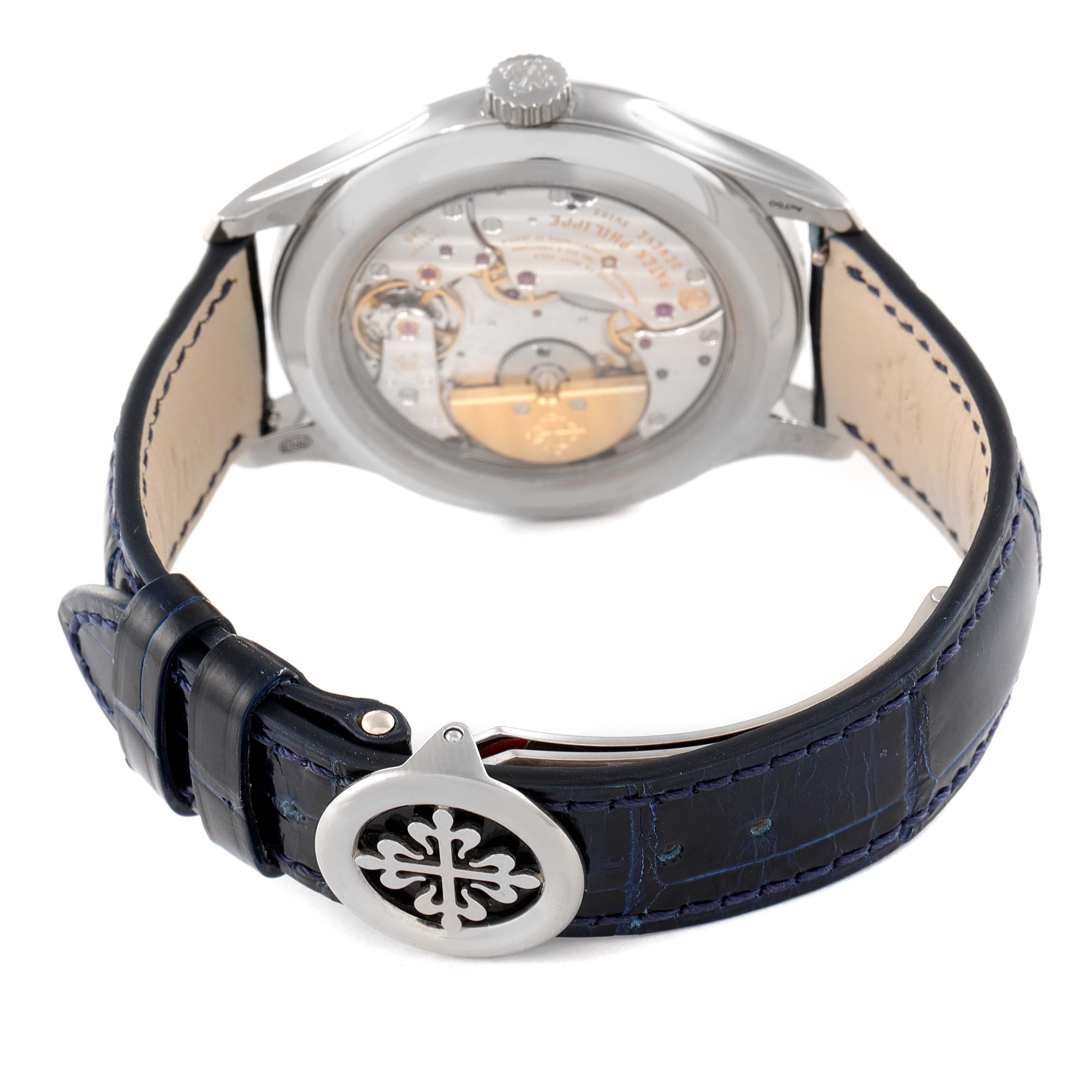 The image shows the back view of a Patek Philippe Complications 5327G-001 Men
s White Gold Blue Dial 5327G-001 Men
s White Gold Blue Dial watch, highlighting the movement and leather strap.