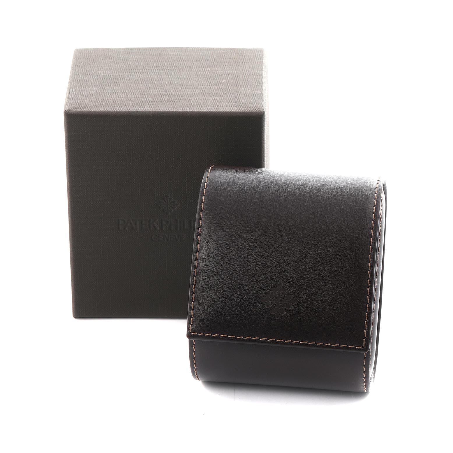 The image shows a Patek Philippe Twenty-4 4910/10A Women's Stainless Steel Blue Dial 4910/10A Women's Stainless Steel Blue Dial watch box and a leather case, both viewed from the front.