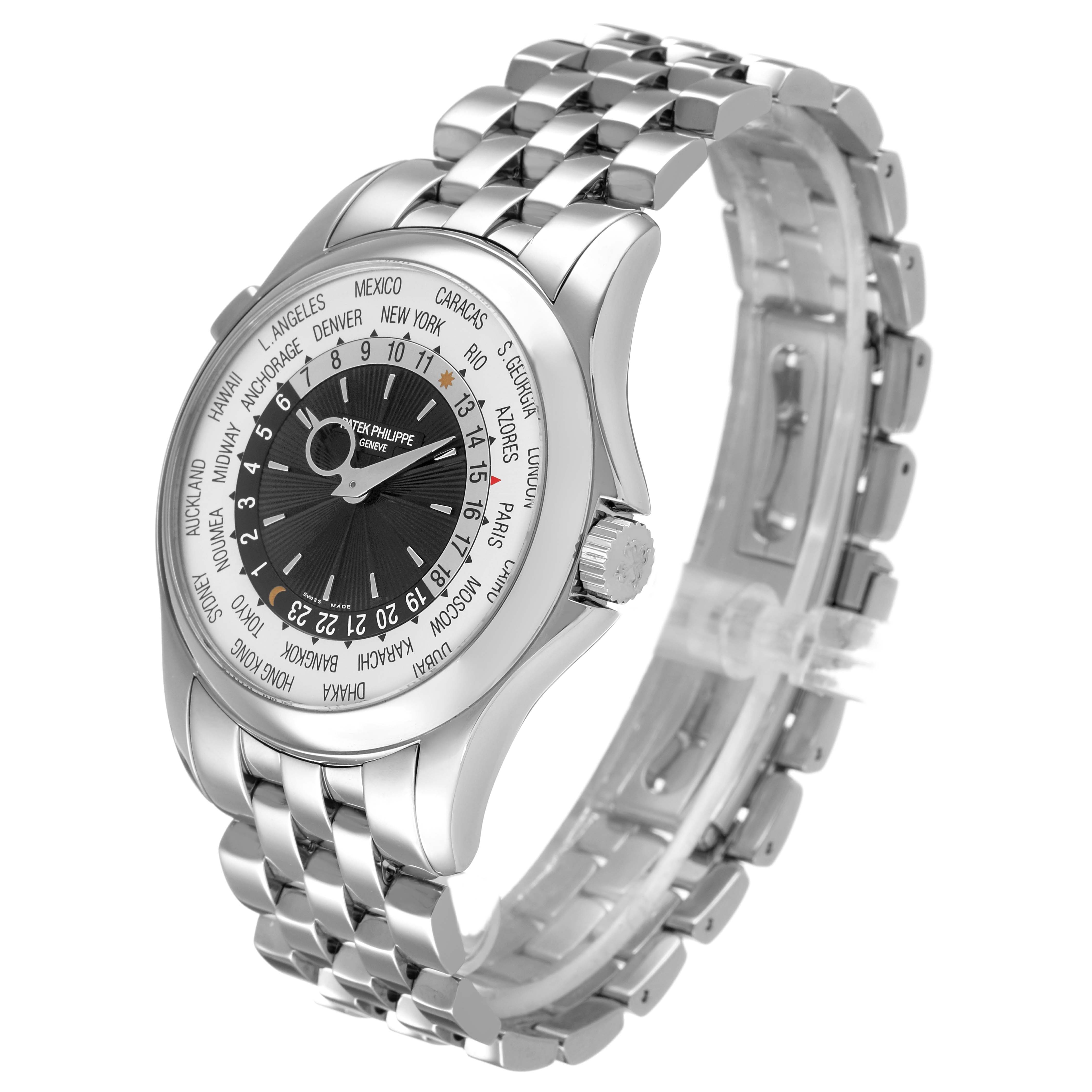 The Patek Philippe Complications 5130/1G-010 Men's White Gold Black Dial watch is shown at a 3/4 angle, highlighting the bracelet, case, and dial with time zones.