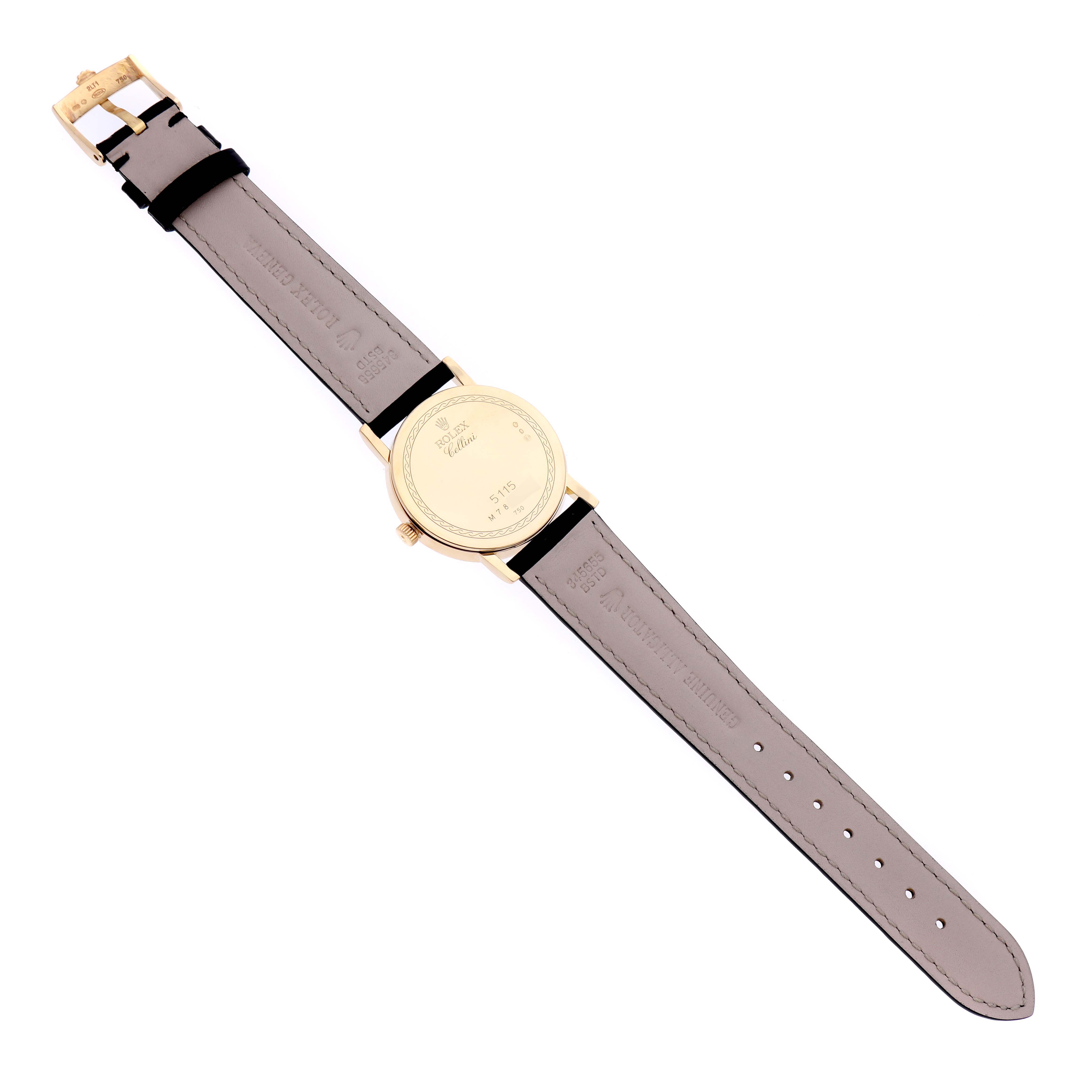 The Rolex Cellini 5115 Men's Yellow Gold Beige Dial 5115 Men's Yellow Gold Beige Dial watch is shown from the back, displaying the case back and leather strap with the buckle visible.