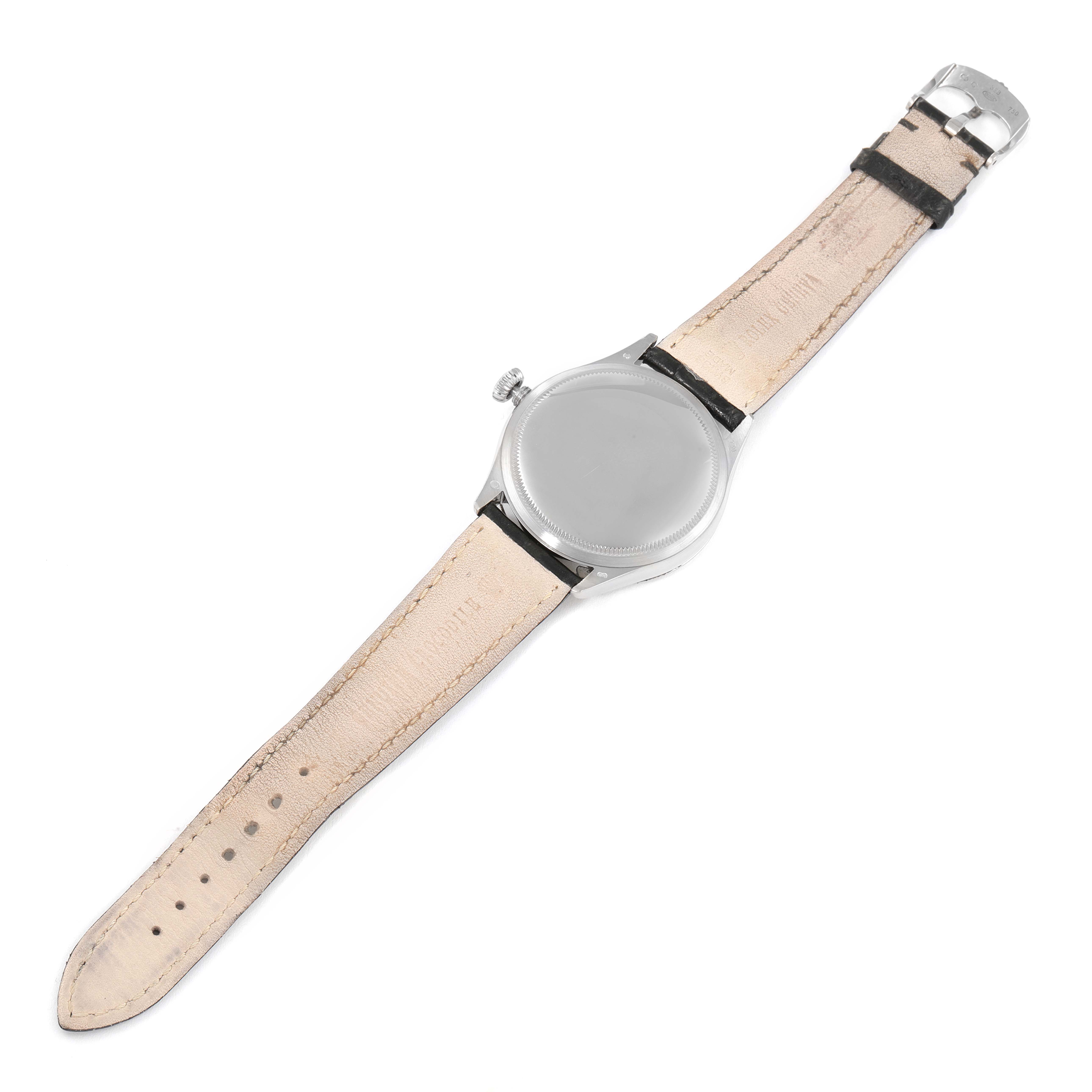 This image shows the back and leather strap of the Rolex Cellini 50509 Men's White Gold White Dial 50509 Men's White Gold White Dial watch from a top-down angle.