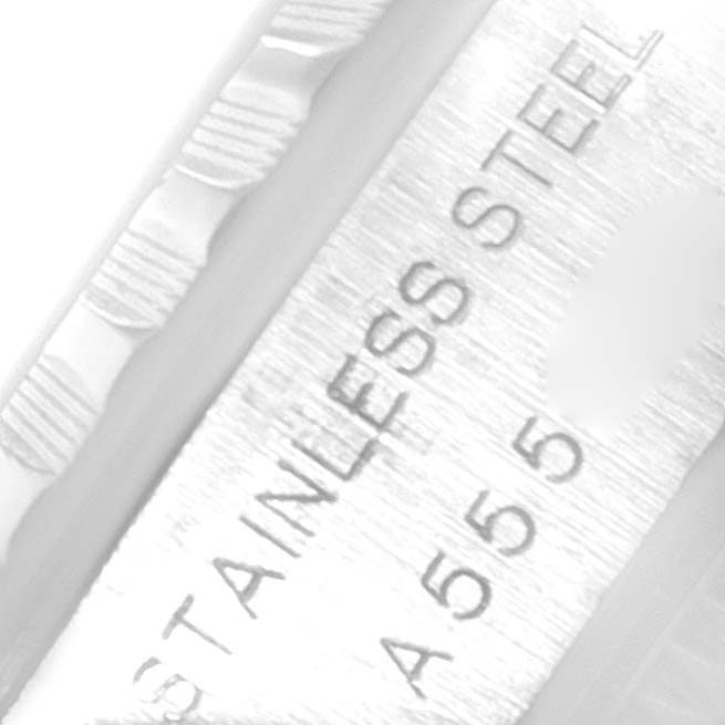Close-up view of the edge and part of the casing on a Rolex Date 79240 Women's Stainless Steel White Dial 79240 Women's Stainless Steel White Dial model watch, showing "STAINLESS STEEL" engraving.