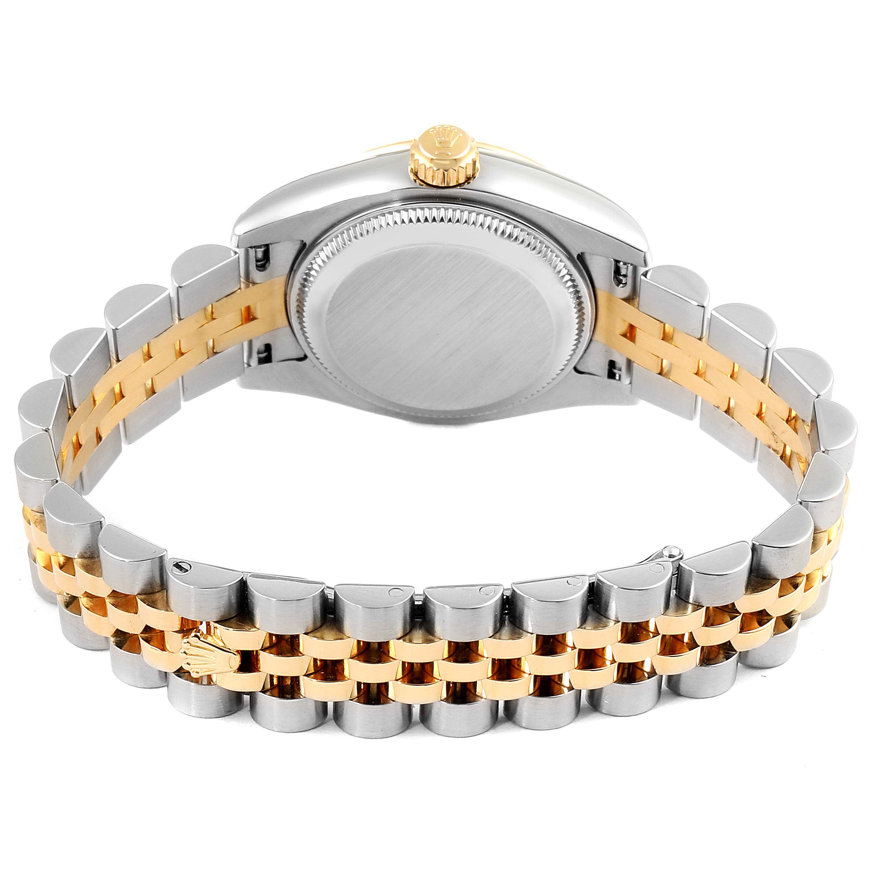 The image shows the back and bracelet of a Rolex Datejust 179173 Women's Steel and Gold (two tone) Champagne Dial 179173 Women's Steel and Gold (two tone) Champagne Dial watch with a two-tone metal finish, viewed from an underside angle.