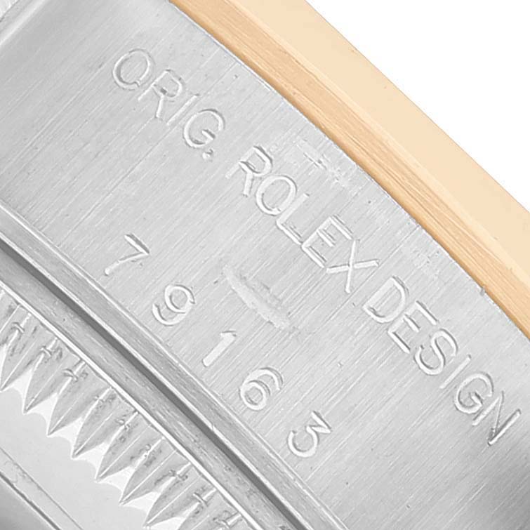 The image shows a close-up of the side of a Rolex Datejust 79163 Women's Steel and Gold (two tone) Grey Dial watch, featuring the engraved model number.